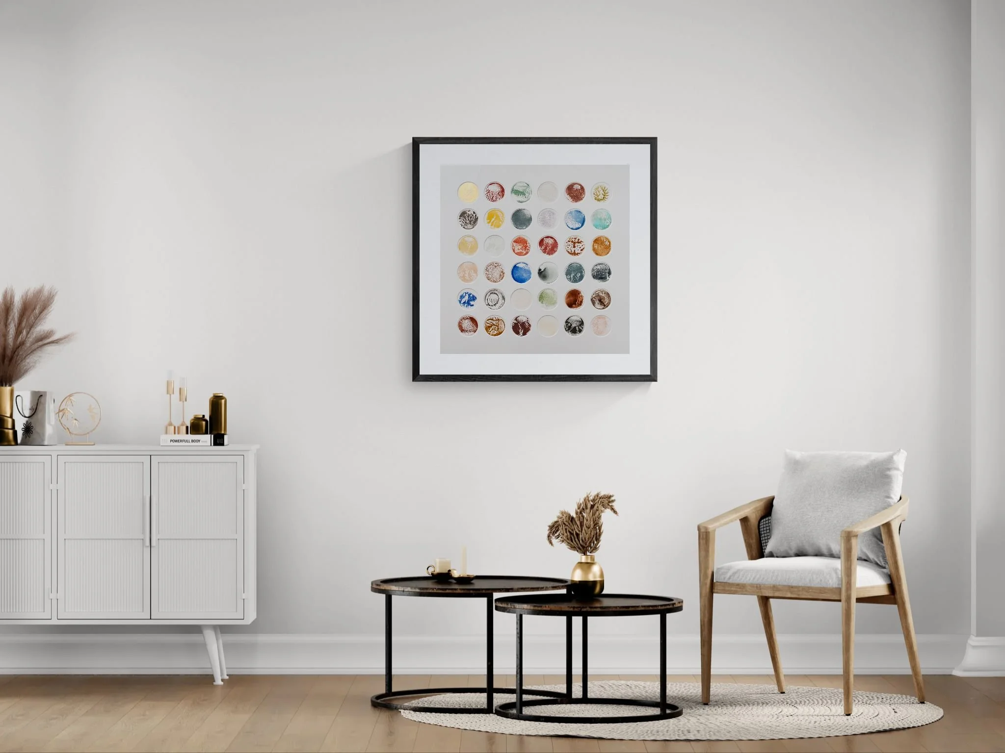 Living area with a chair and round tables.jpeg