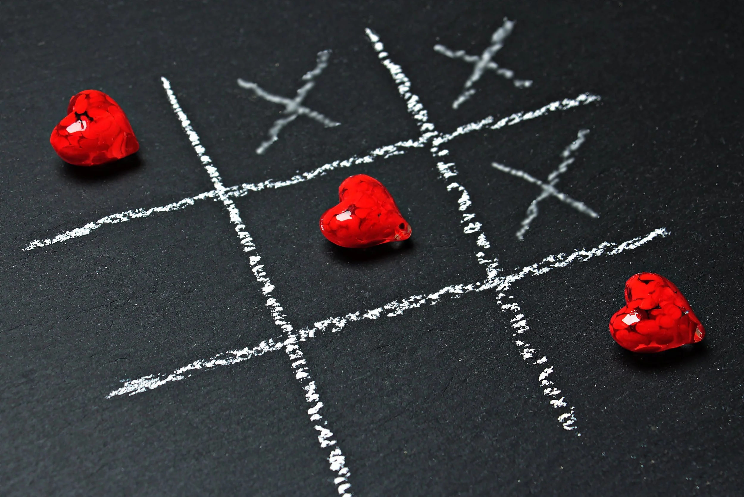 Tic tac toe with x's and hearts to represent shared family fun