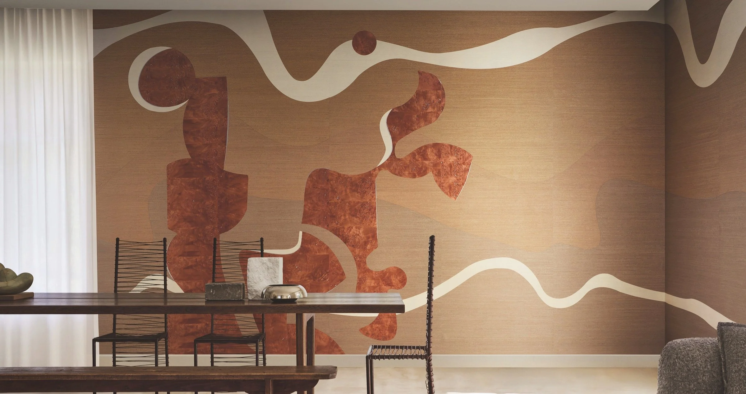 Omexco Kim Mupangilaï wallcovering featuring sculptural organic forms in warm natural tones within a contemporary dining interior.