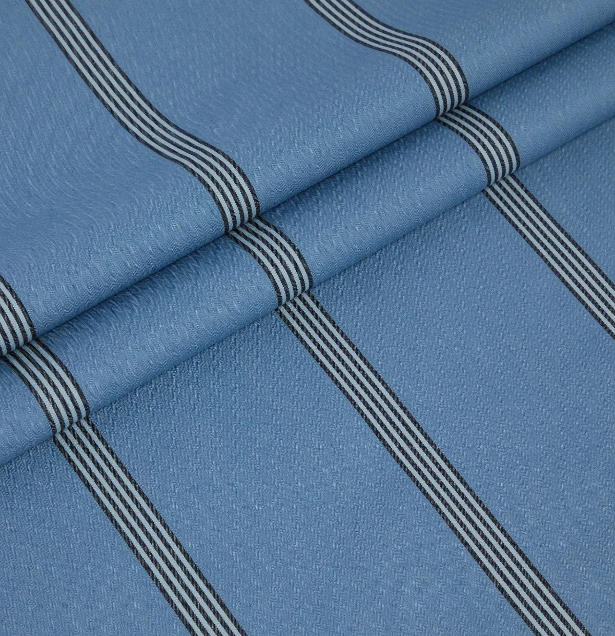 Ian Mankin Beacons Collection Ballycastle Stripe blue herringbone fabric with a contrasting broad stripe.