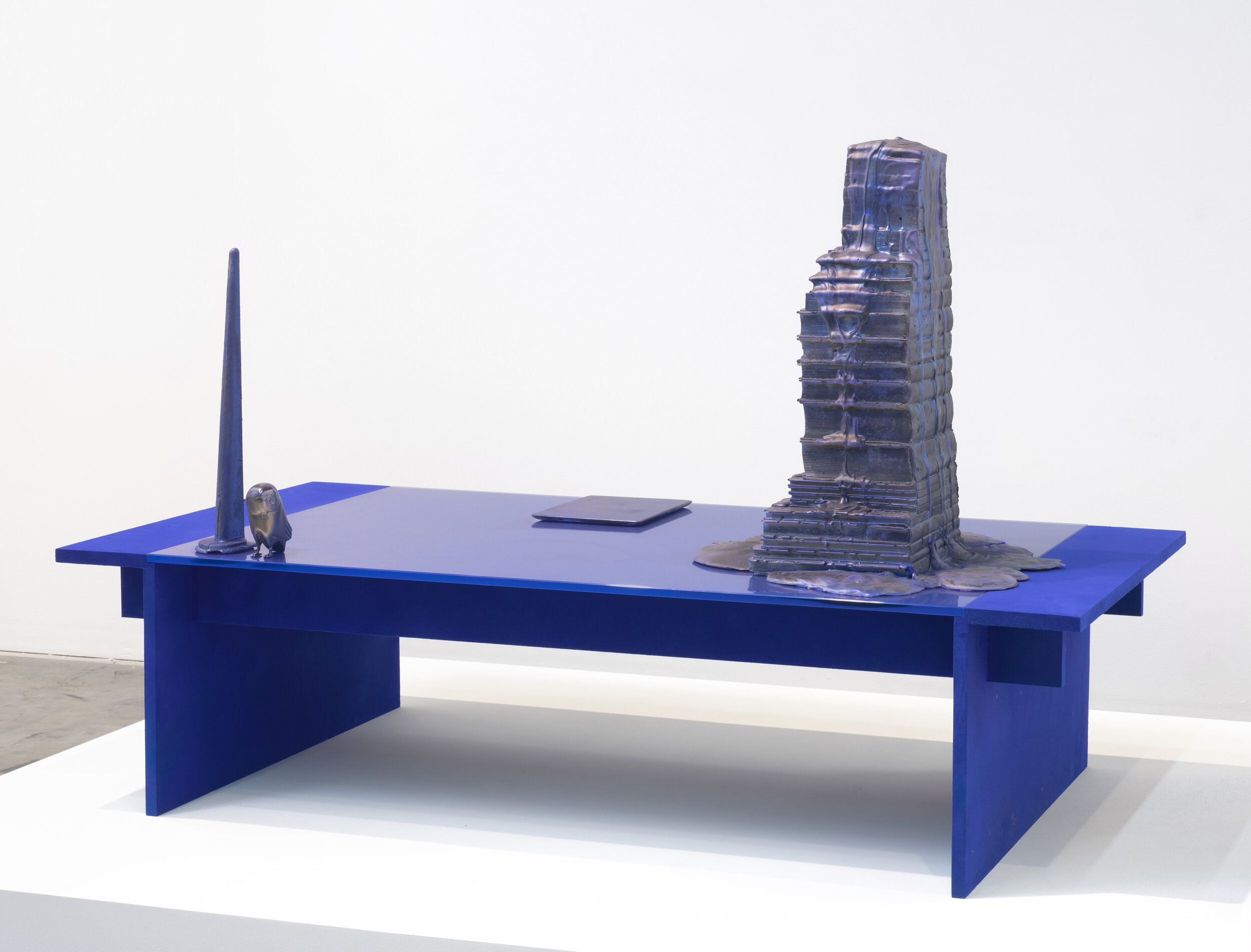   Coffee Table in Ultramarine with Objects,  2014. Wood, flocking, glass, hydrocal, and various store bought goods. 60 x 30 x 38 inches 