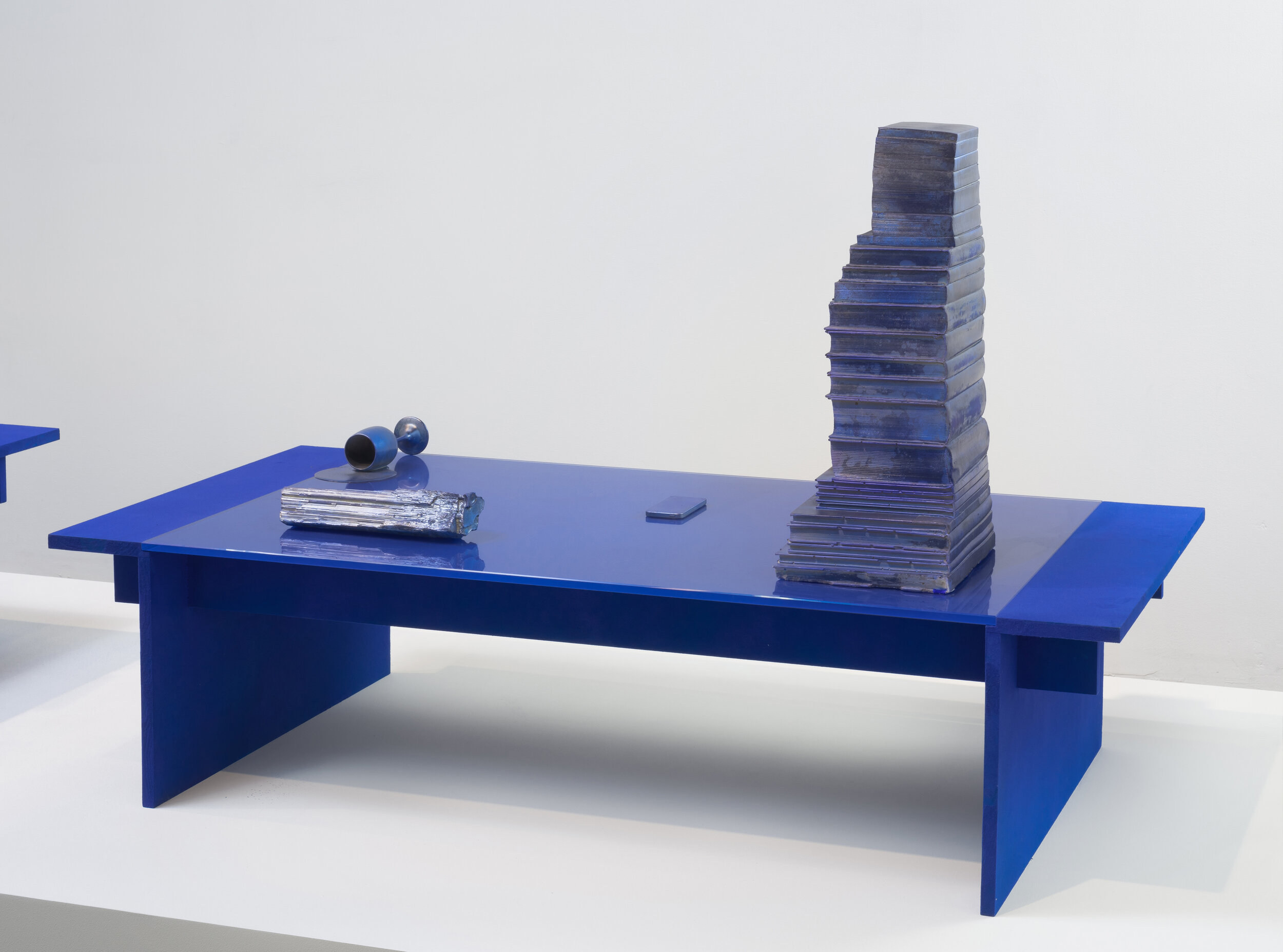   Coffee Table in Ultramarine with Objects,  2014. Wood, flocking, glass, hydrocal, and various store bought goods. 60 x 30 x 38 inches 