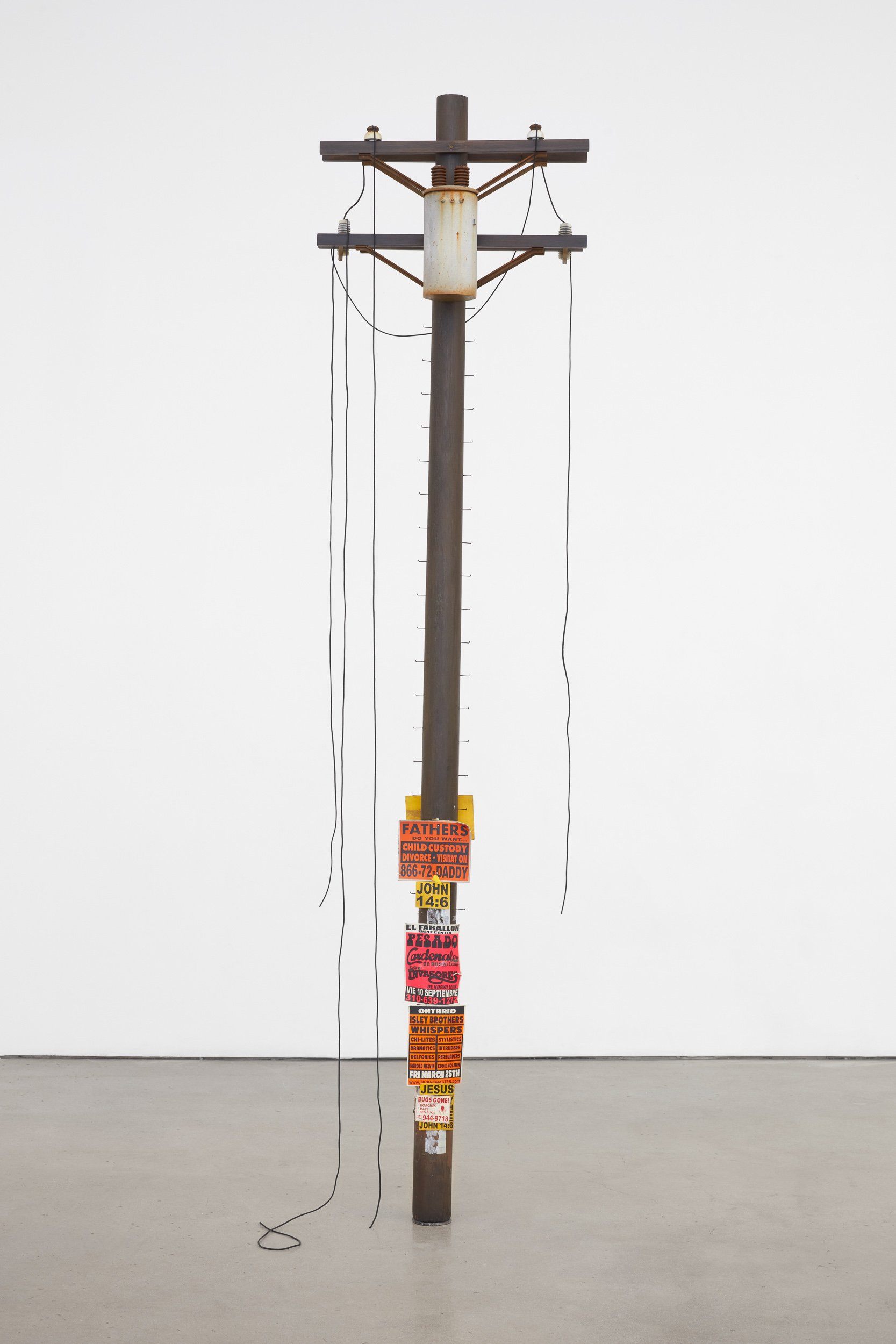   Totem,  2022. Bondo, acrylic and solvent based paints on wood, paper, steel, nylon shoelace, PVC, and vinyl. 96 x 23 x 10 inches 
