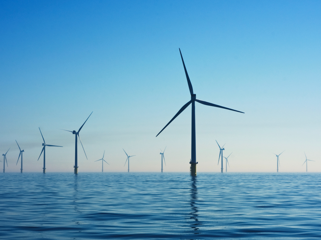 Wind turbines representing the UK’s clean energy transition and new training pathways into offshore wind.