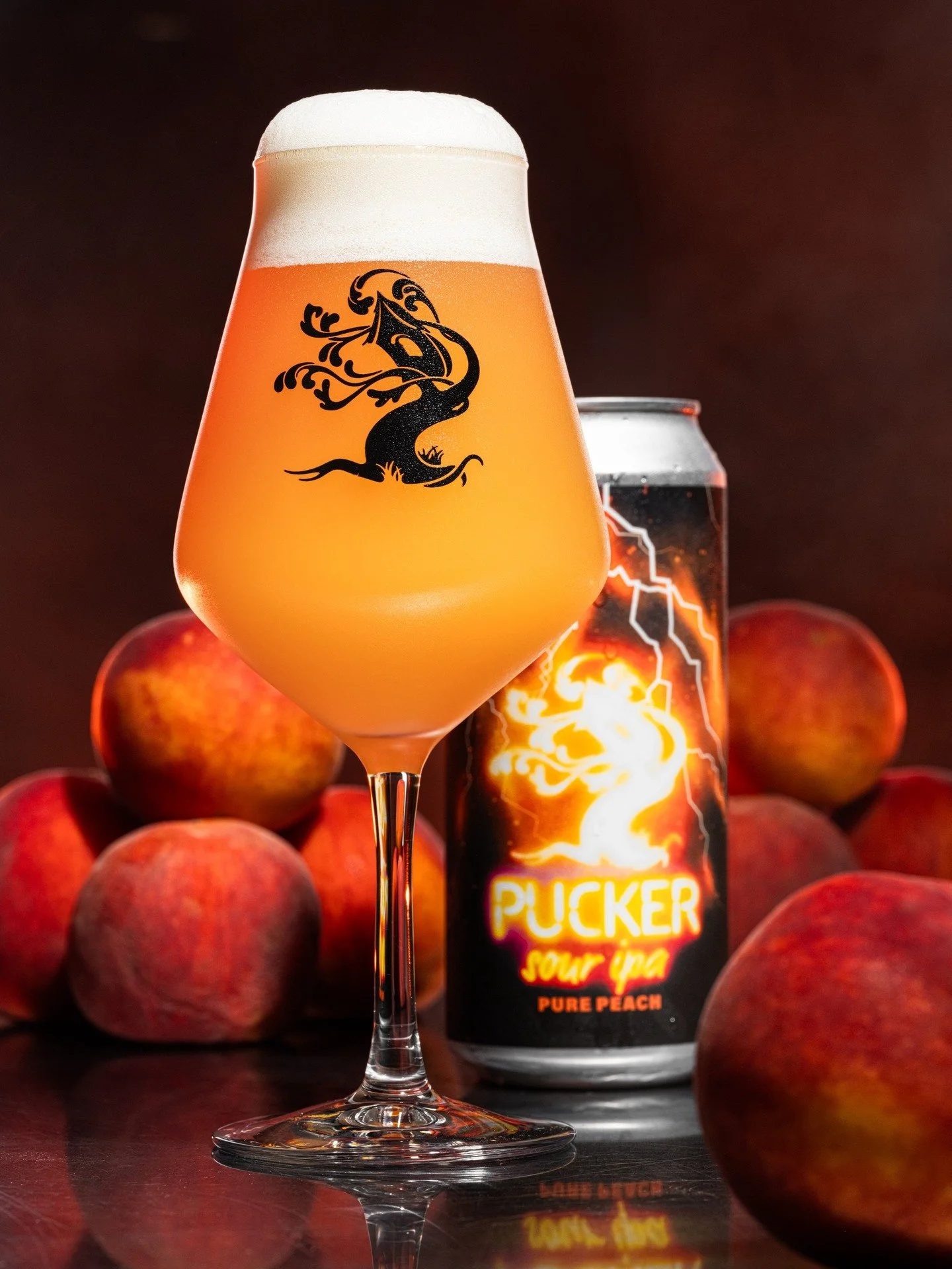 What the heck are we gonna do with all these peaches? 

Pucker Pure Peach is our latest beer in our Sour IPA series. We used a blend of our house yeast and a novel sour strain, and the results are oh-so-refreshing. This blend added a layer of refinem