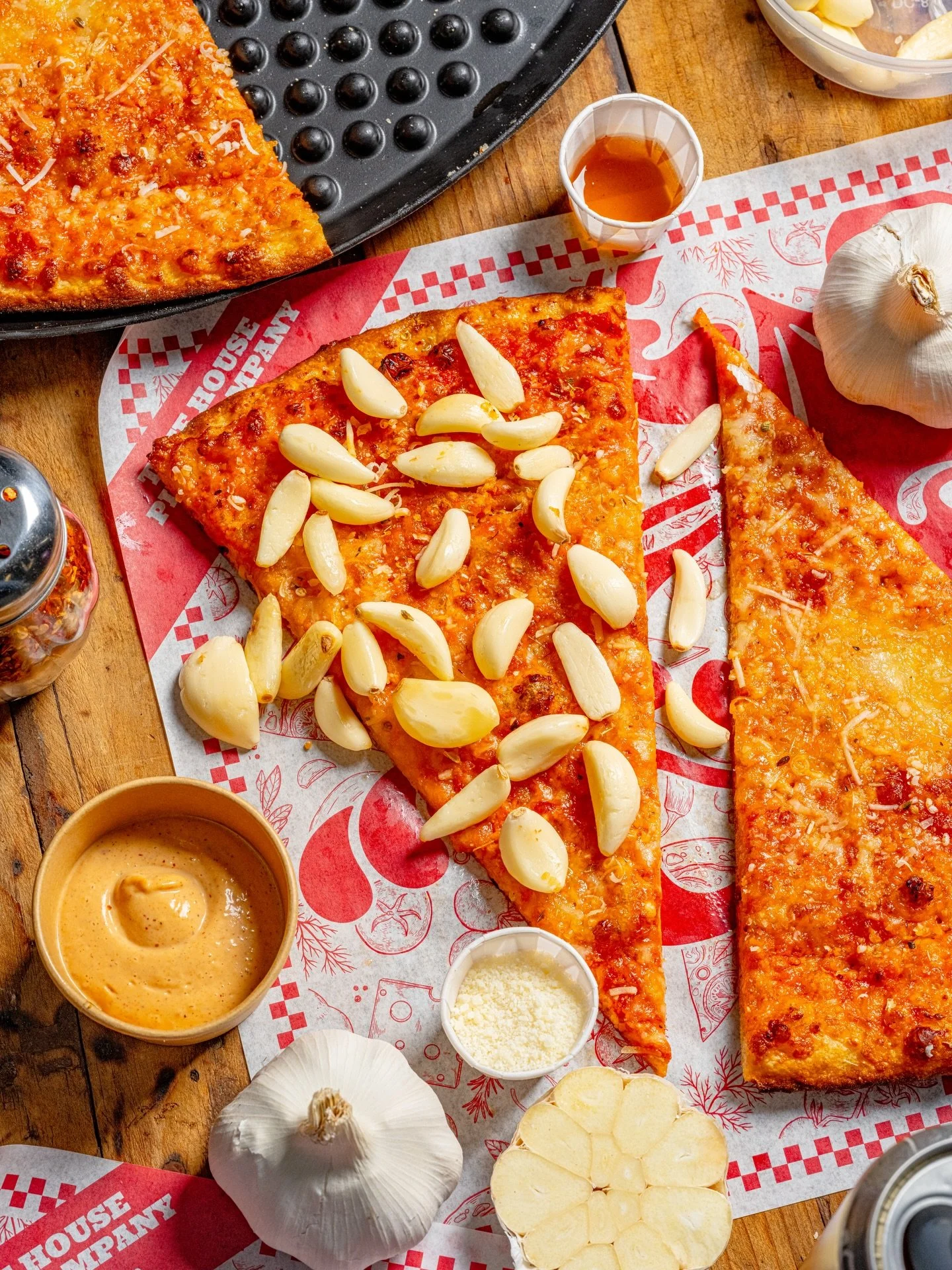 This month&rsquo;s pizza of the month: Garlic Confit Cheese.

It would be impossible for us to express our love for this flavor bomb in words, so instead we&rsquo;ll just say that you&rsquo;ve got to try it.

A house blend of punchy aged cheeses play