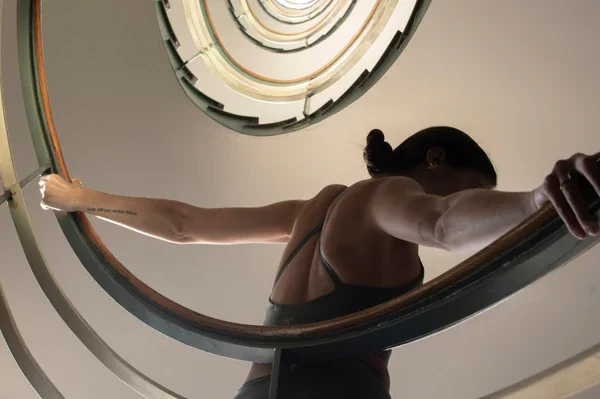 Woman moving and dancing in ballter studio.webp