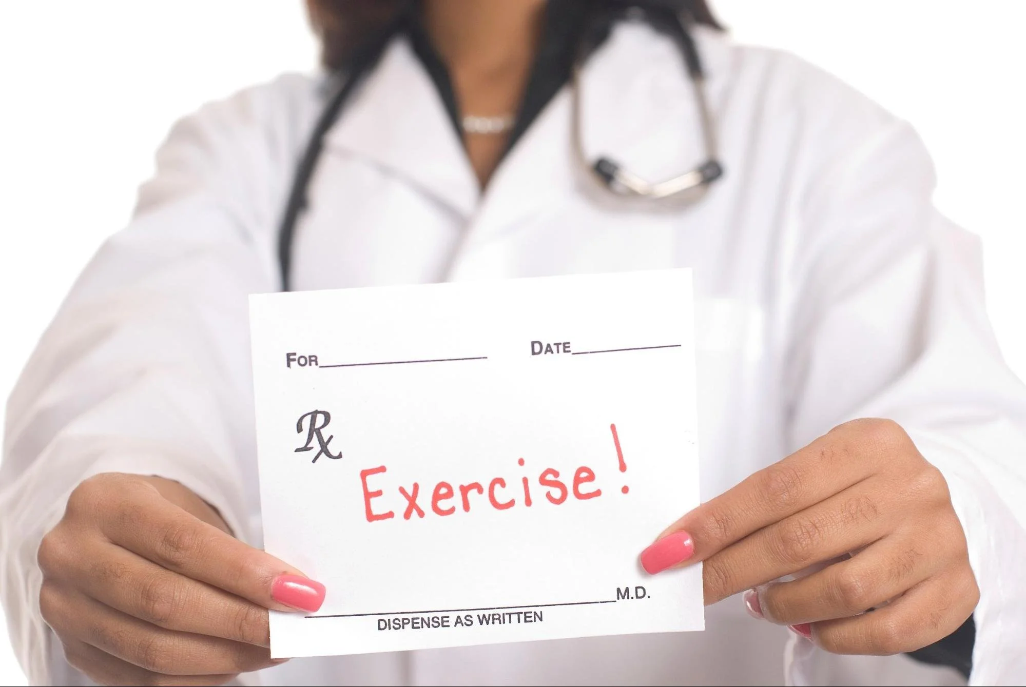 A healthcare professional holding a prescription slip with 'Exercise!' written on it in red ink.