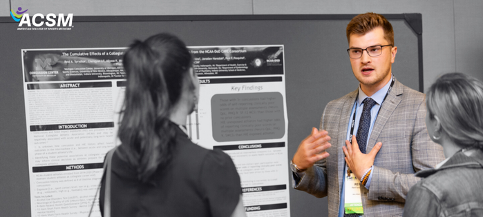 Man explaining a research poster to two women at an academic conference, with the ACM logo in the top left corner.