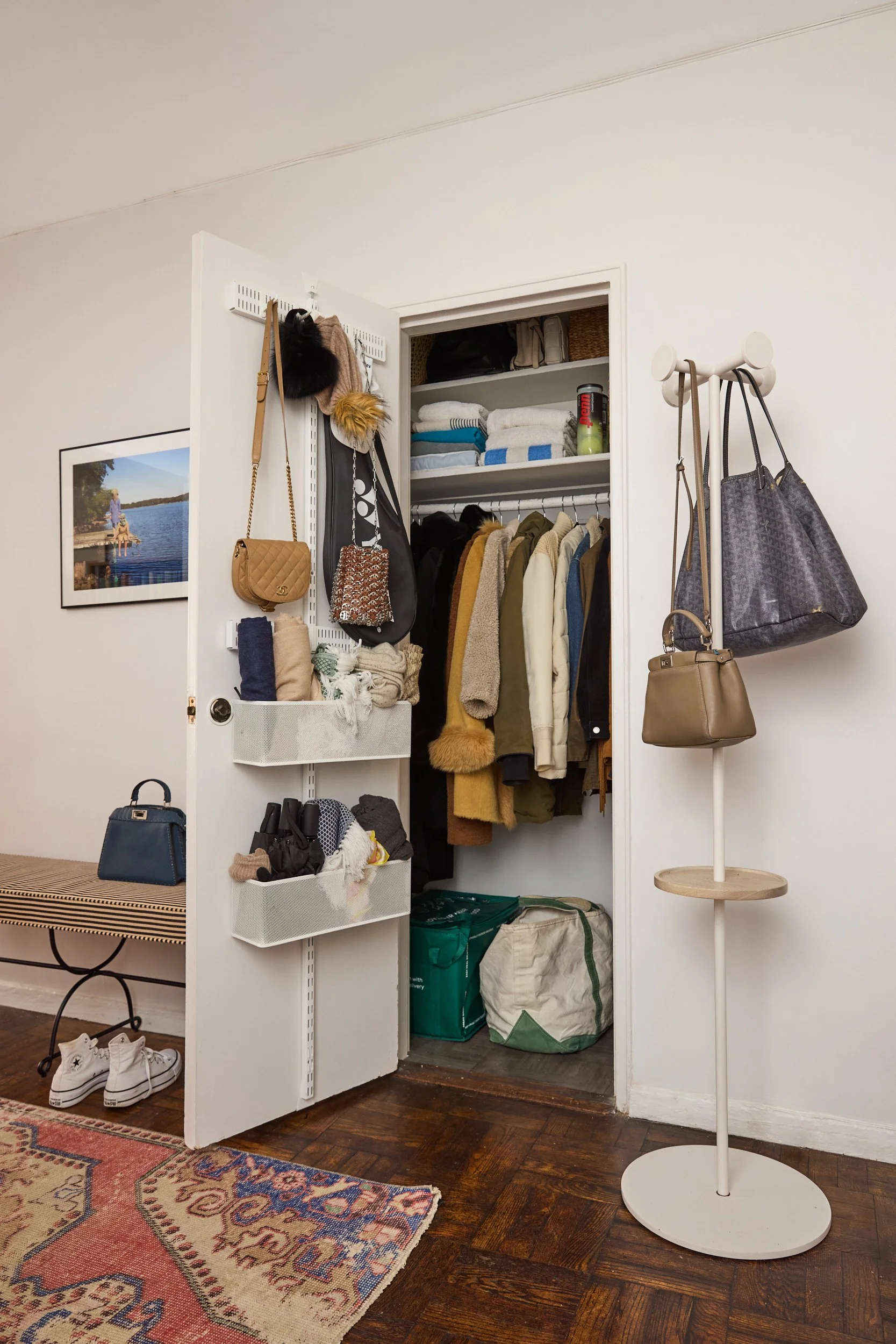 hall coat closet organization in entry of Gramercy 1 bedroom apartment in NYC