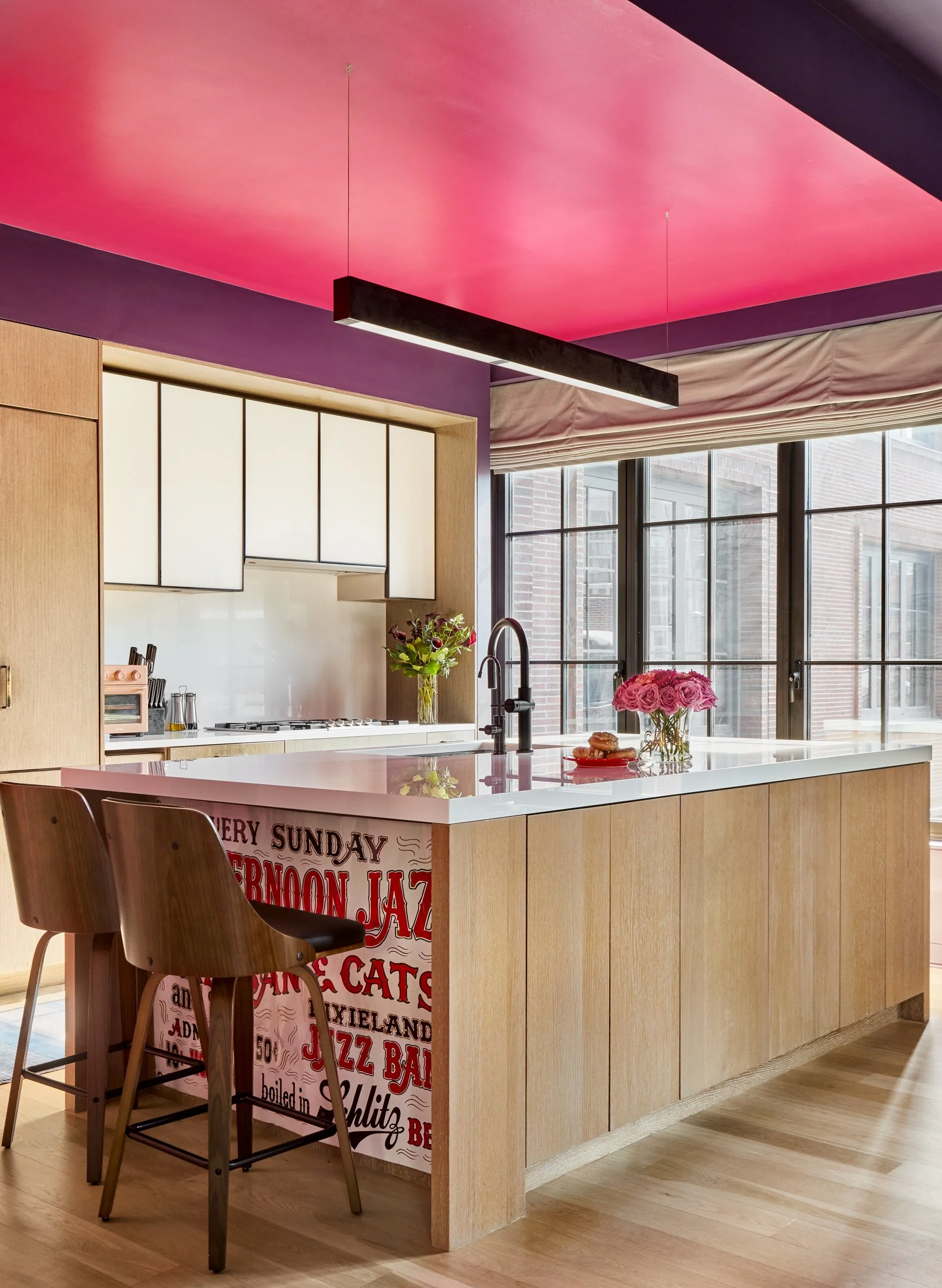 creative art hanging of cherished family memento vintage metal sign under kitchen island 