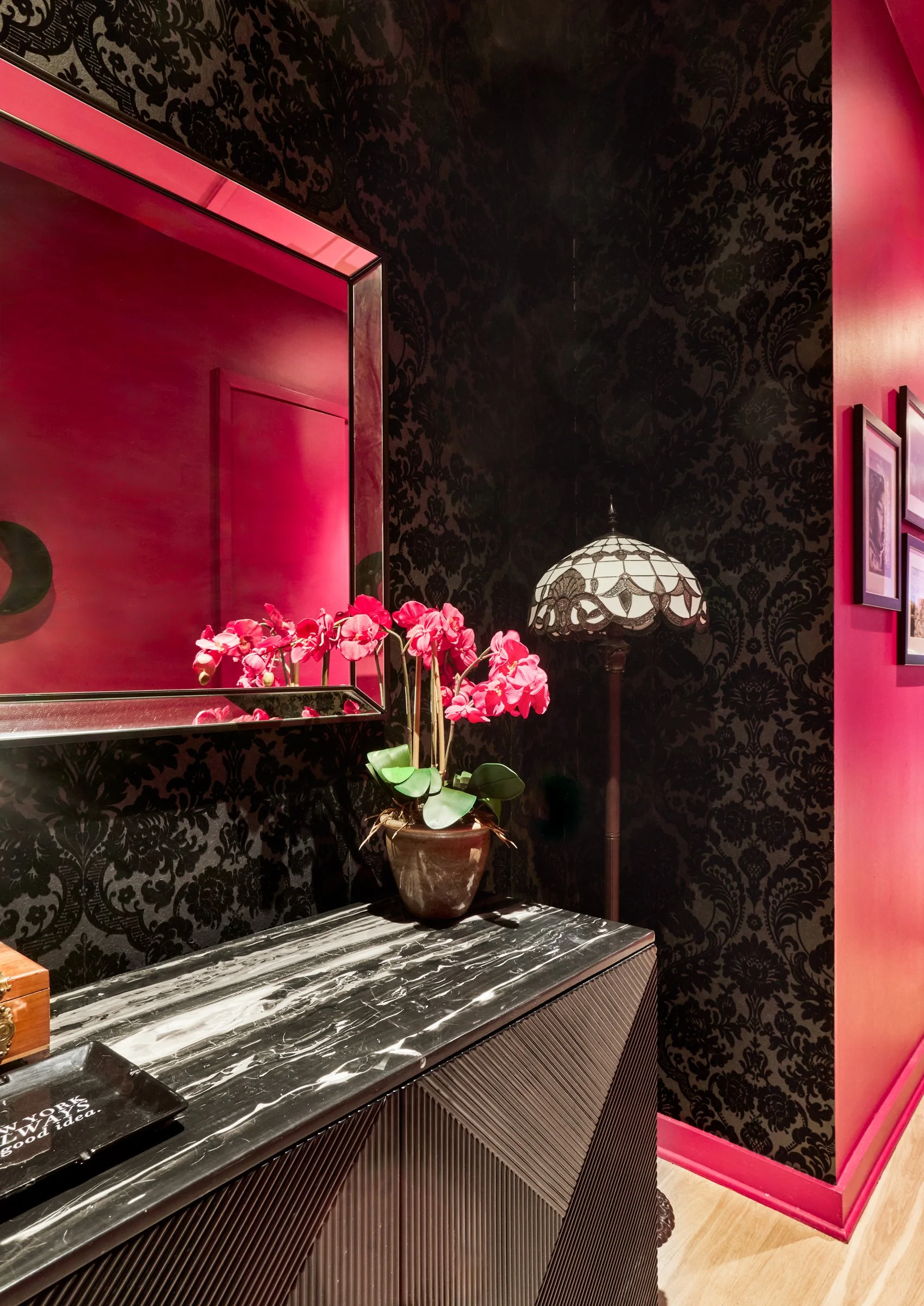 black damask flocked wallpaper entry and high gloss lacquered color drenched hallway