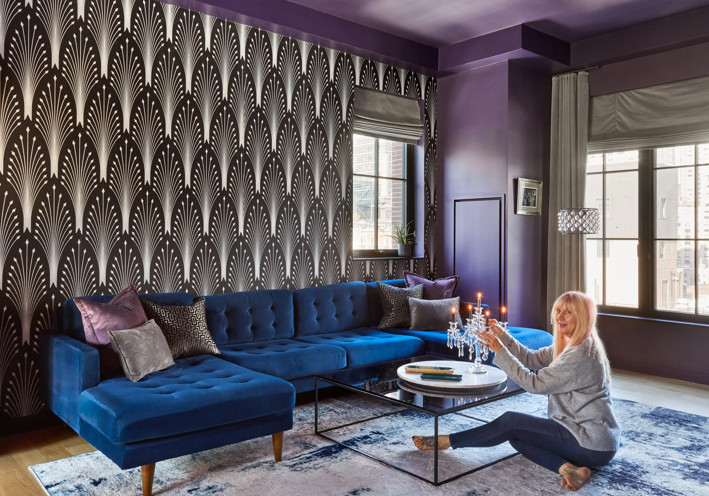 Joybird L shape sectional with chaise in cobalt pops against the silver and black wallpaper in the living room of this NYC apartment