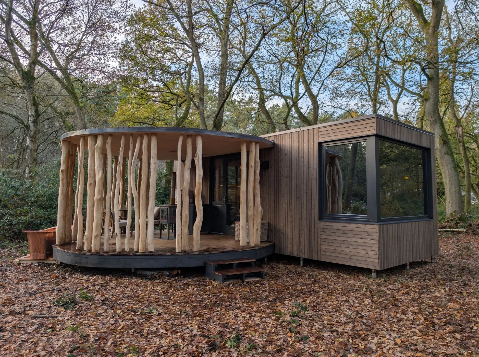 This is a bespoke luxury cabin built in the woods of Cheshire. Mirror glass and charred cladding.