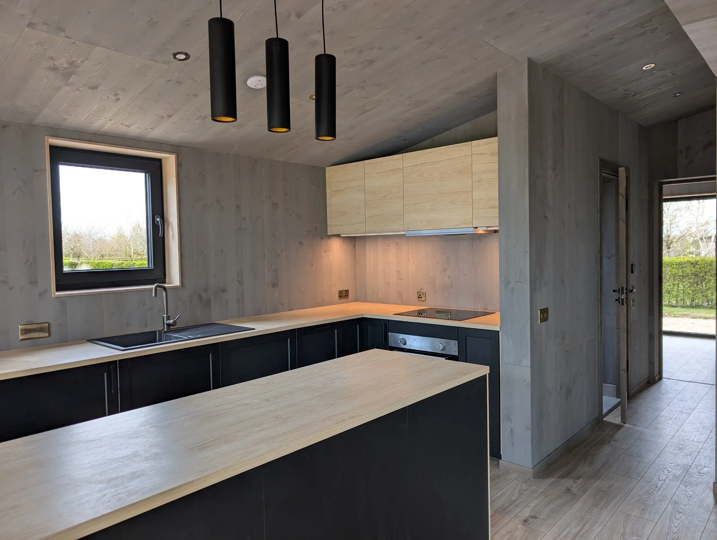 This image shows a kitchen for a luxury lodge called the Nordstar, with a stunning Scandi kitchen