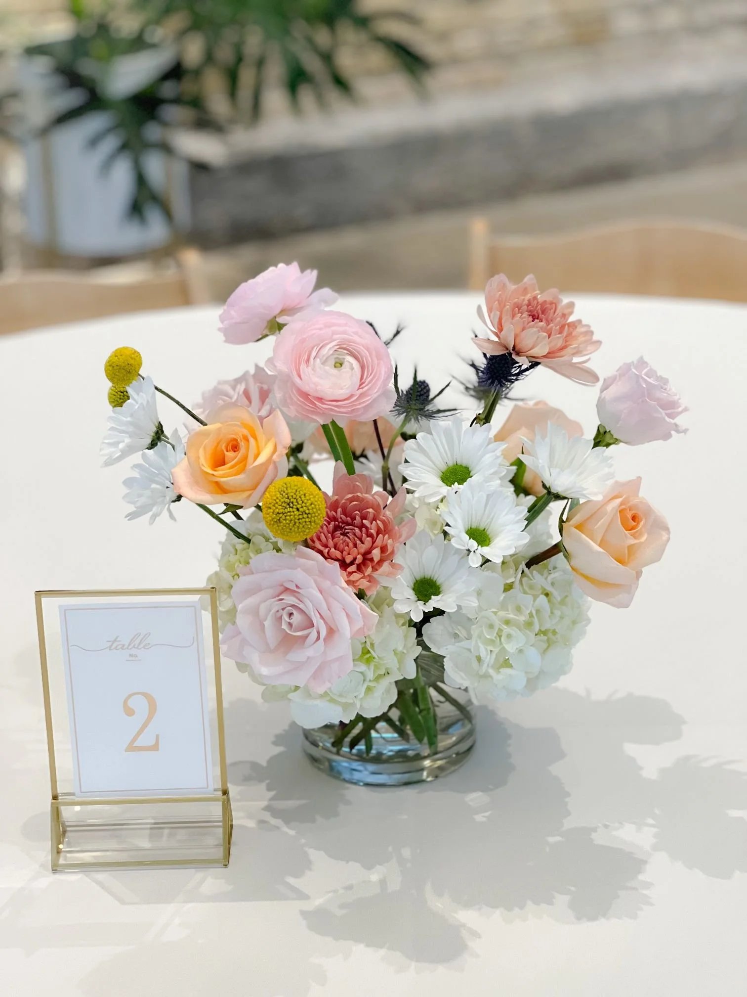 Peach white blue centerpiece in cylinder.jpg