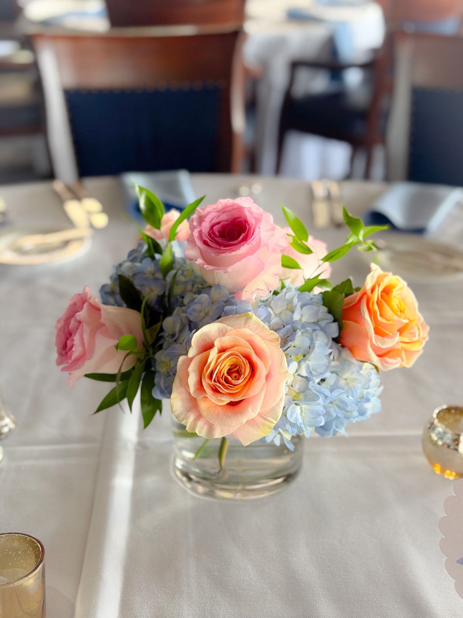 Blue hydrangea pink peach rose centerpiece.jpg