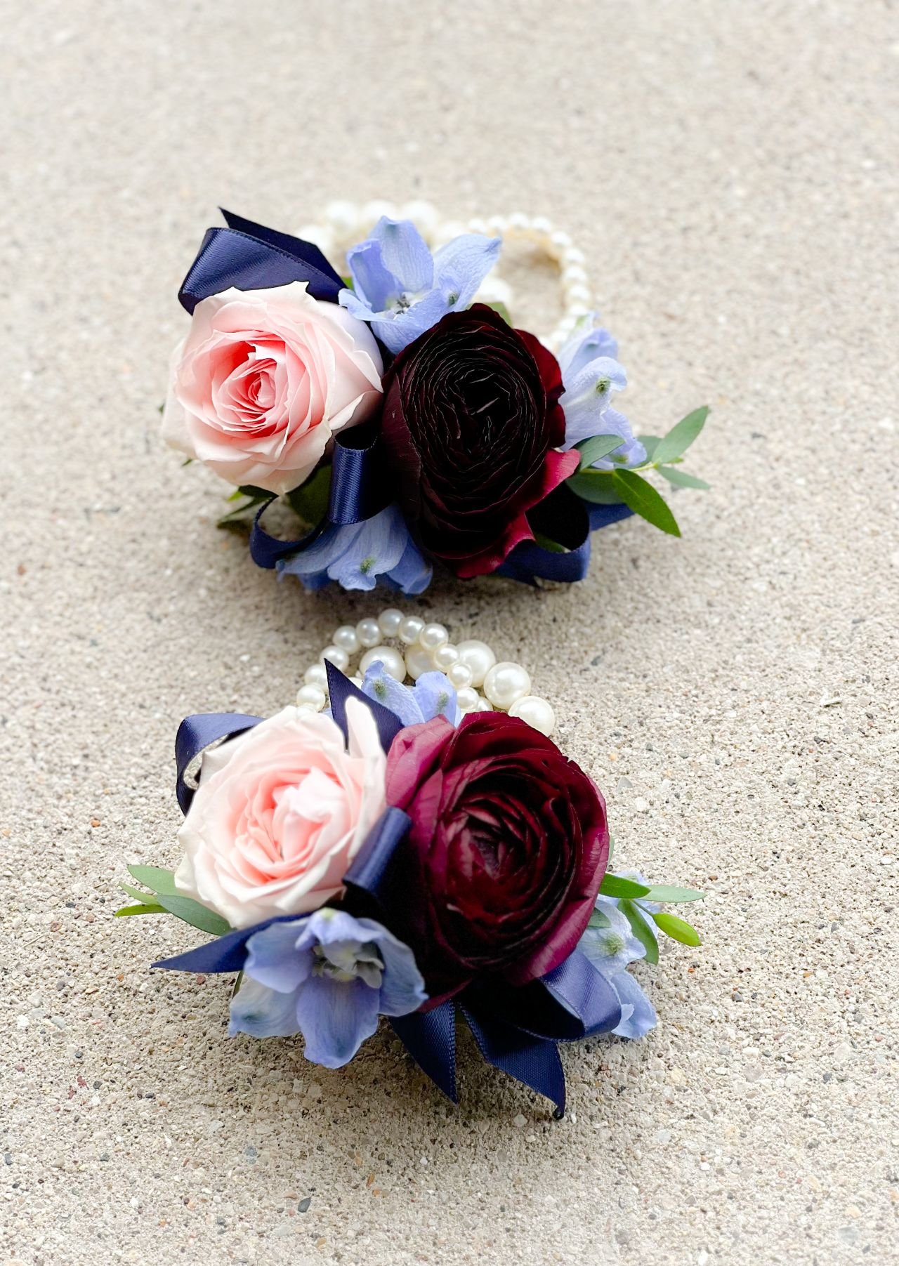 Plum ranunculus delphinium wrist.jpg