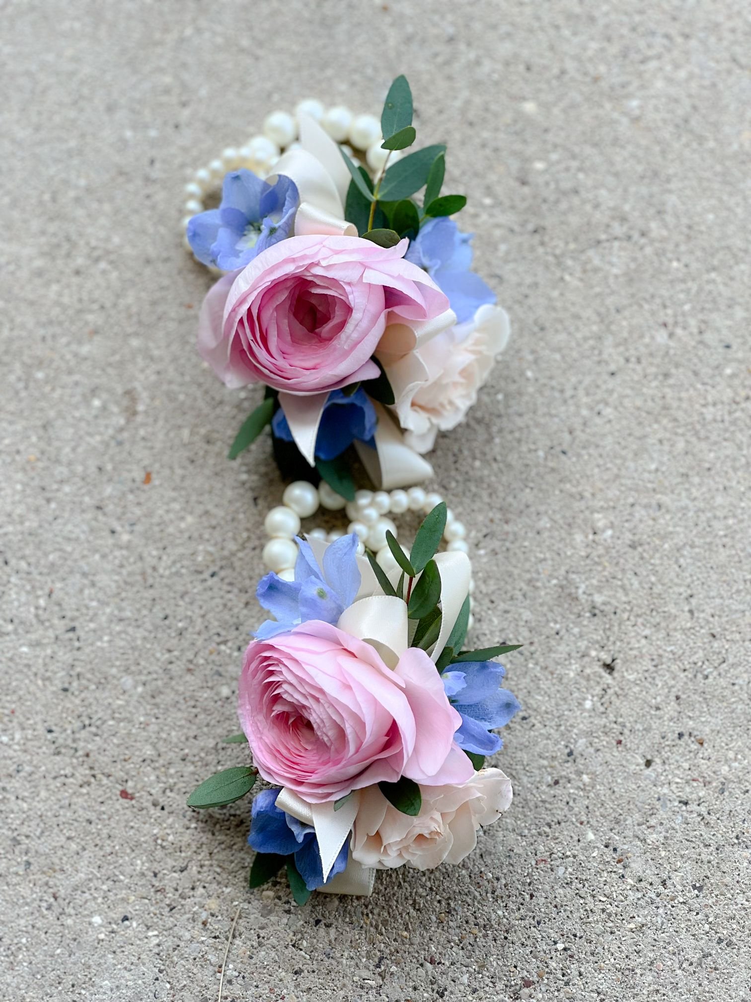 pink ranunculus delphinium wrists.jpg