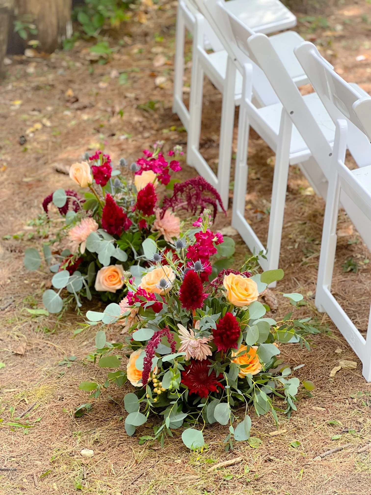 Burgundy peach chair bouquets.jpg