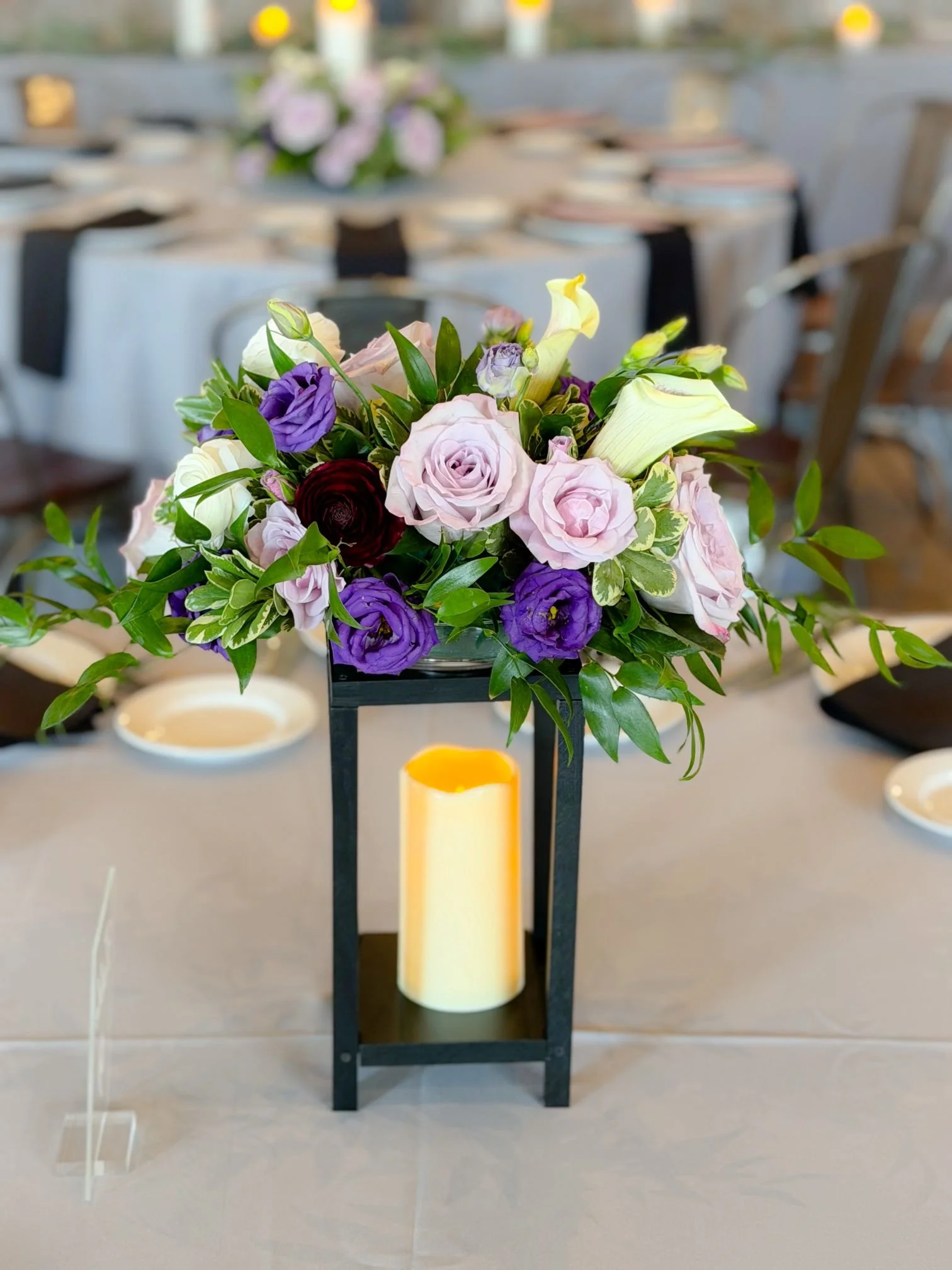 Black lantern purple lavender floral centerpiece.jpg