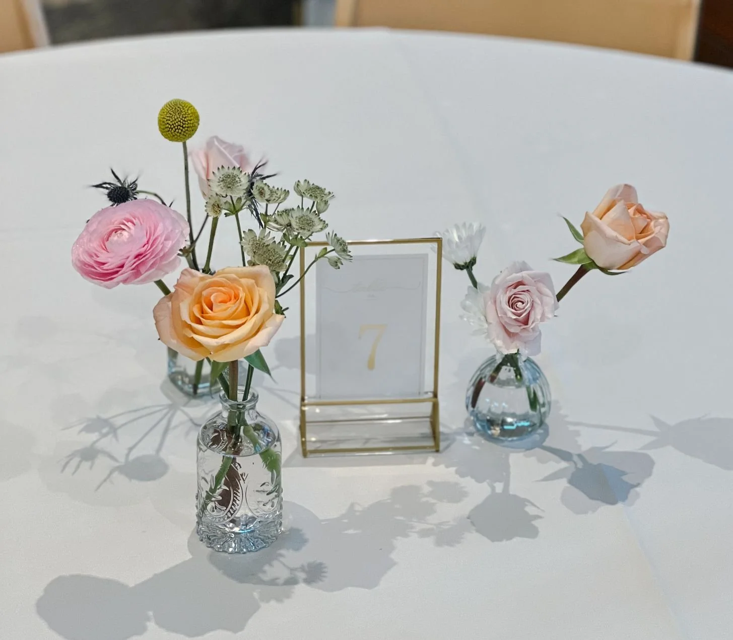 Bud vase daisies ranunculus.jpg