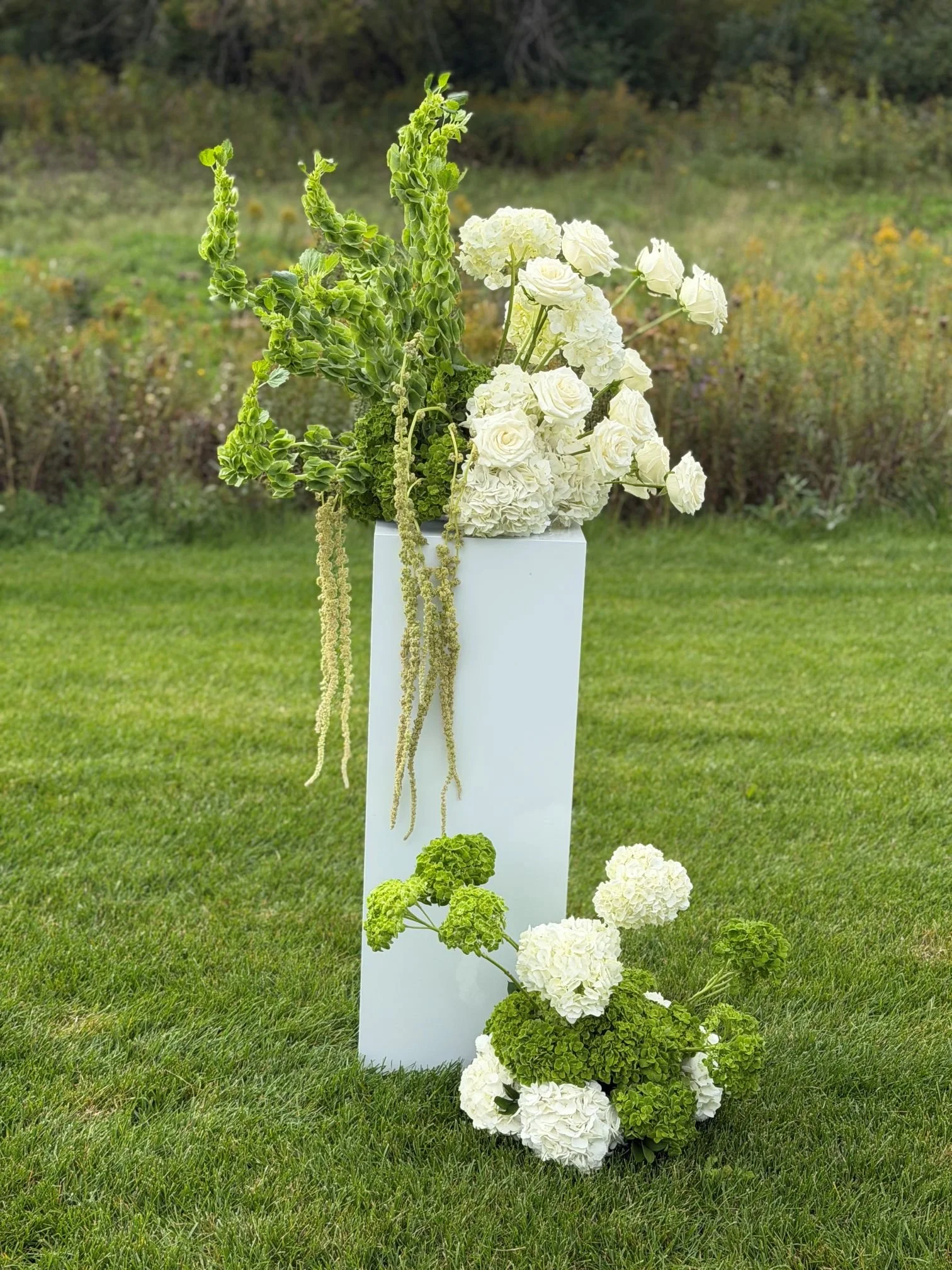 White stands asymmetrical designs.jpg