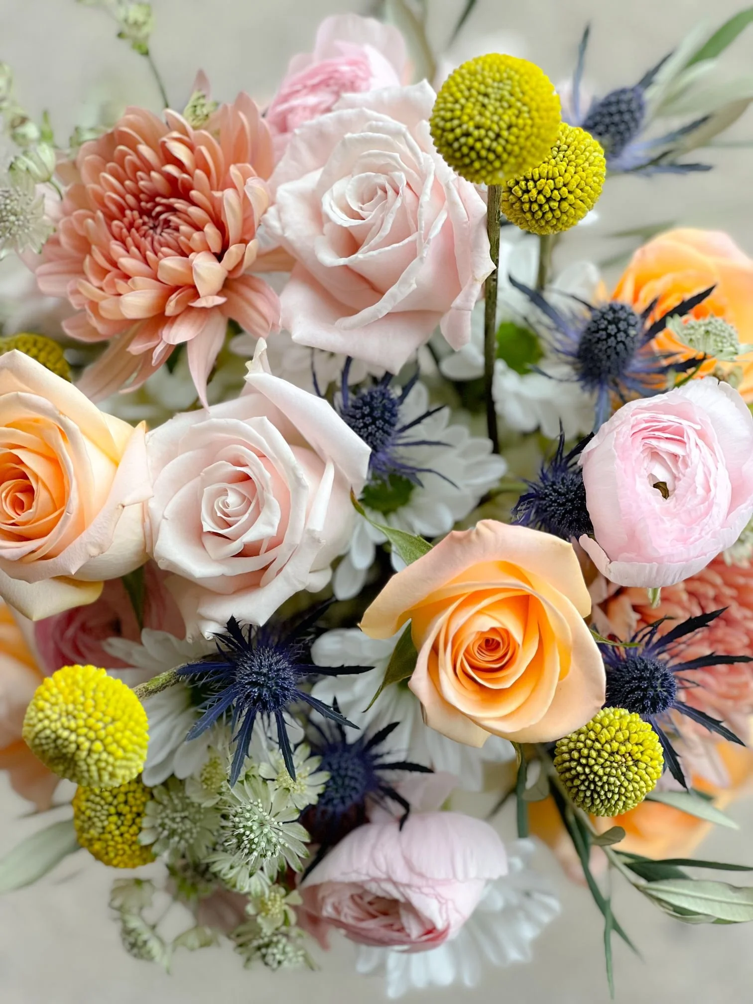 Peach white blue craspedia bridal closeup.jpg