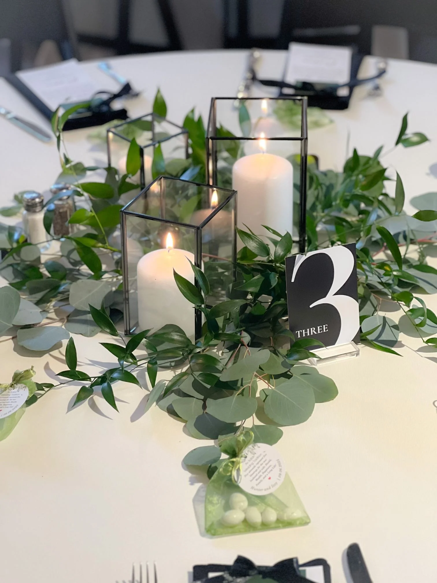 Black pillar holders greenery.jpg