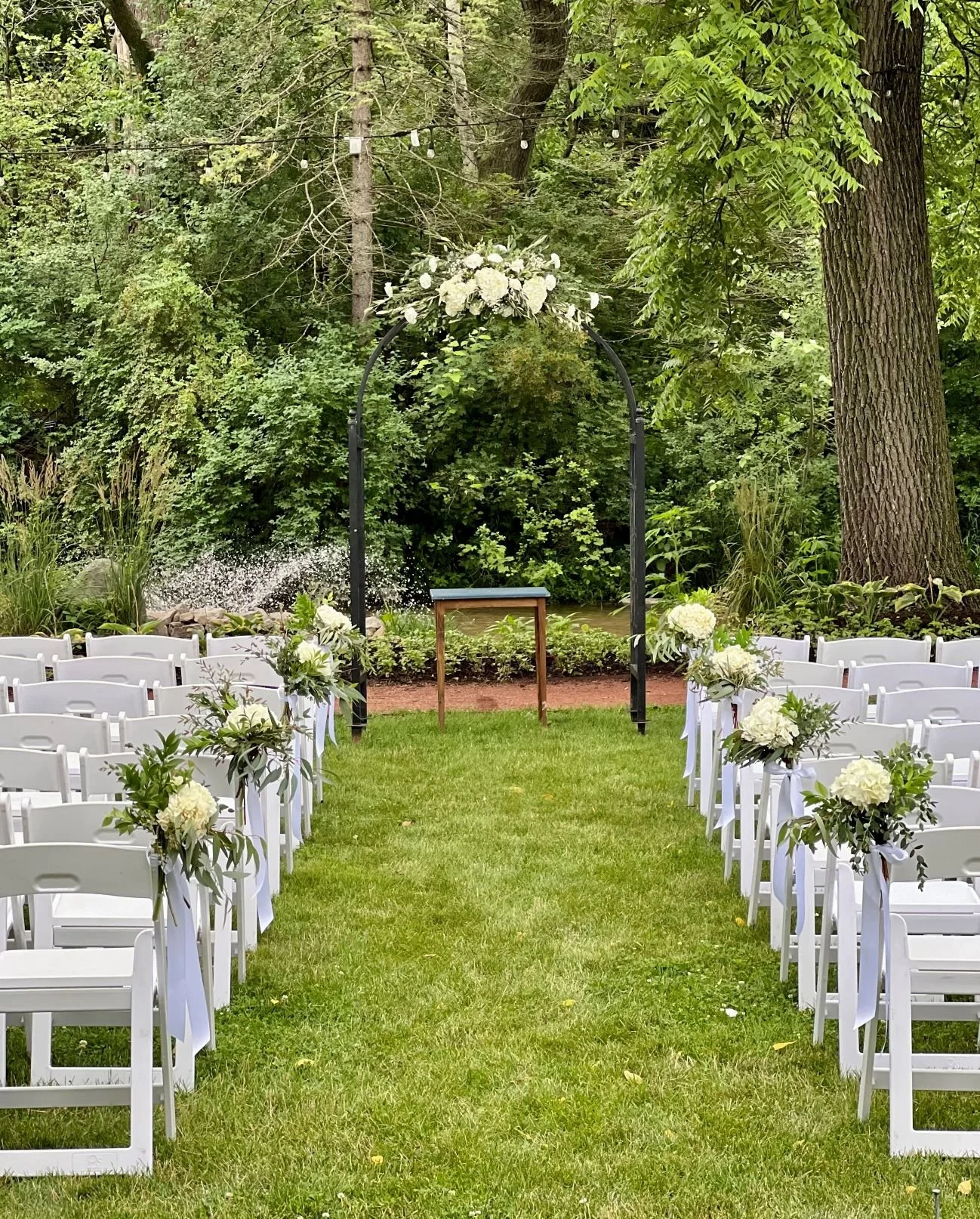 Shullys arch and chair bouquets.jpg