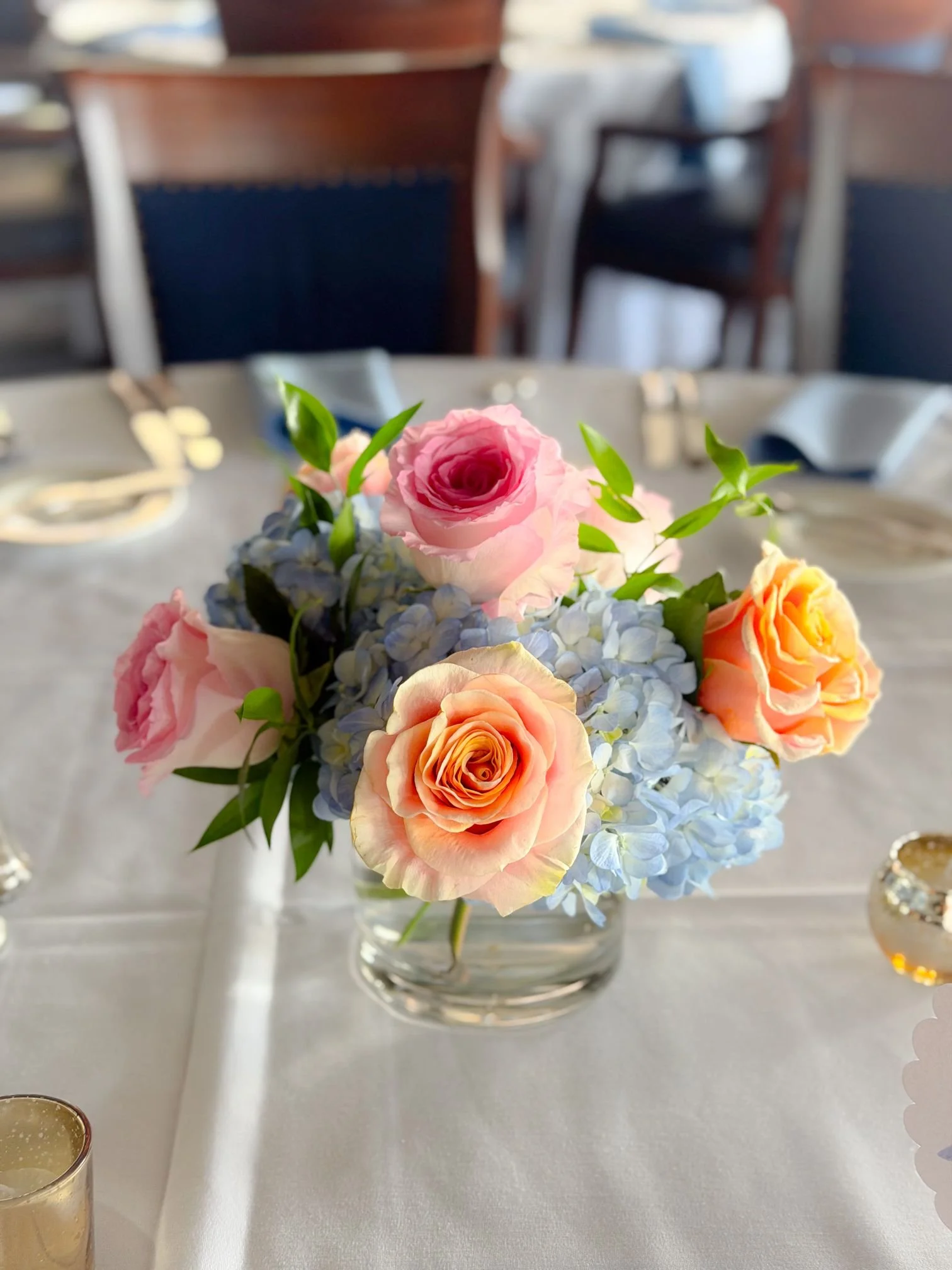 Blue hydrangea pink peach rose centerpiece.jpg