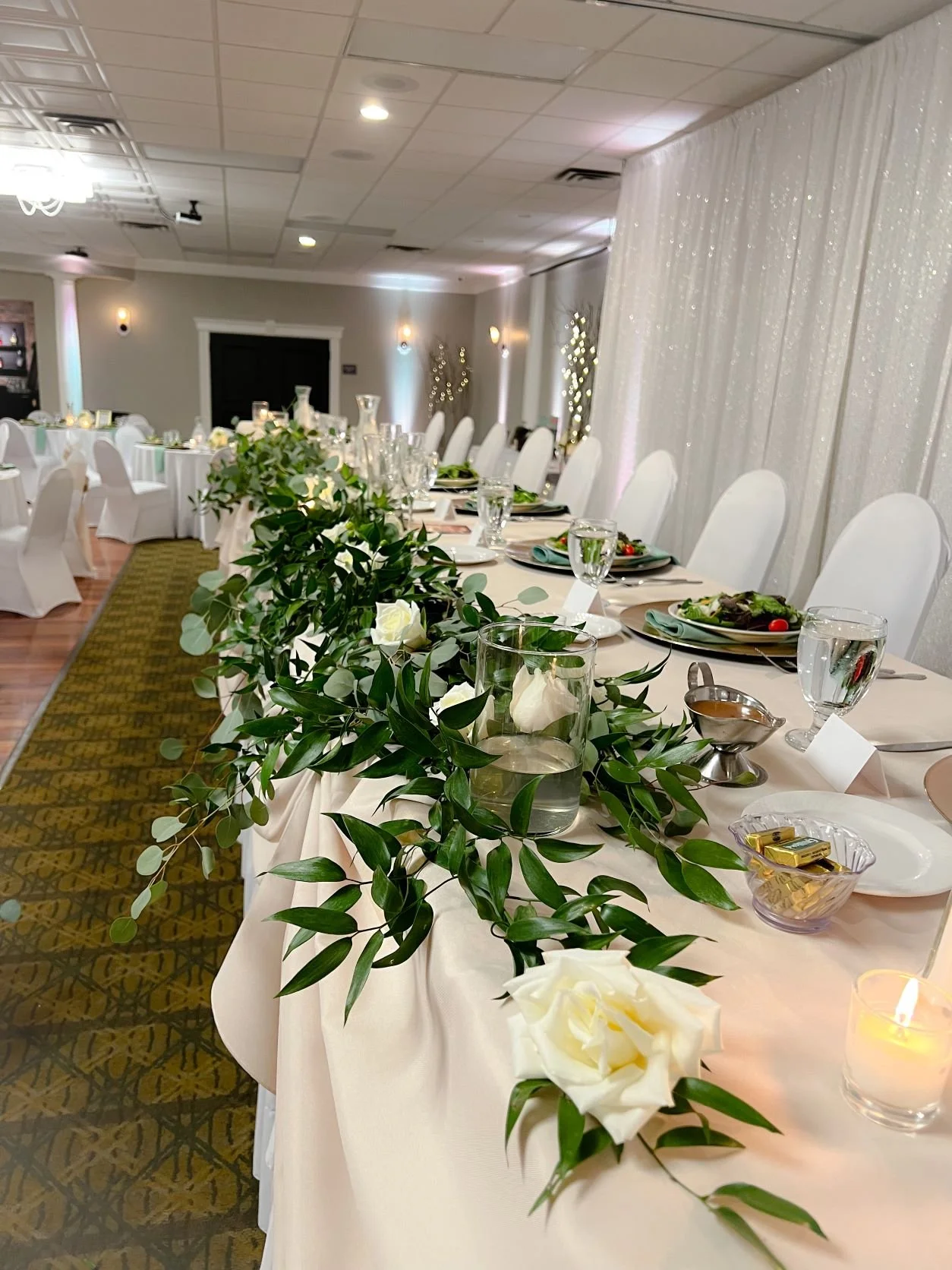 Florian head table greenery roses.JPEG