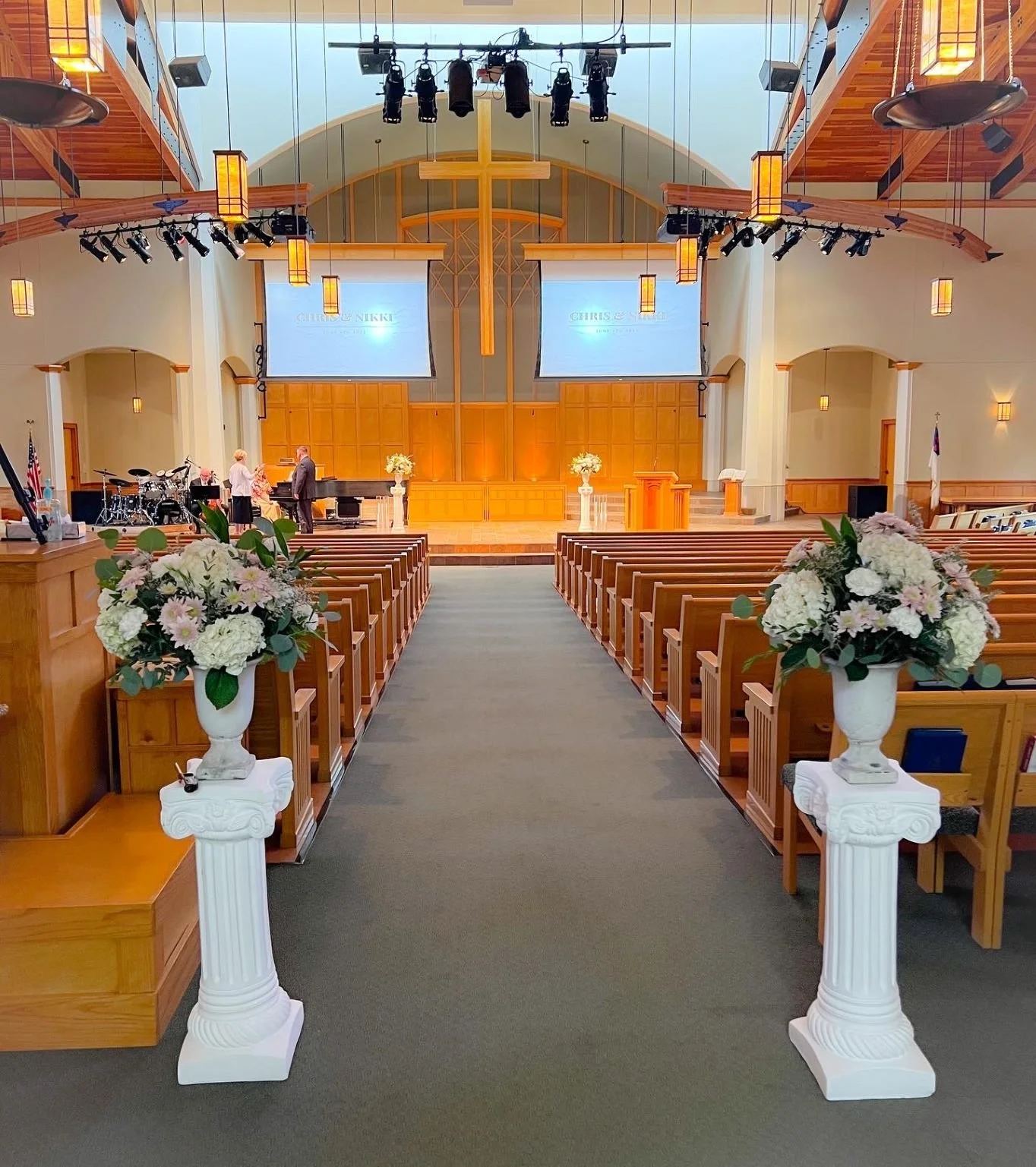 Crossroads church ceremony arrangements roman columns.JPG