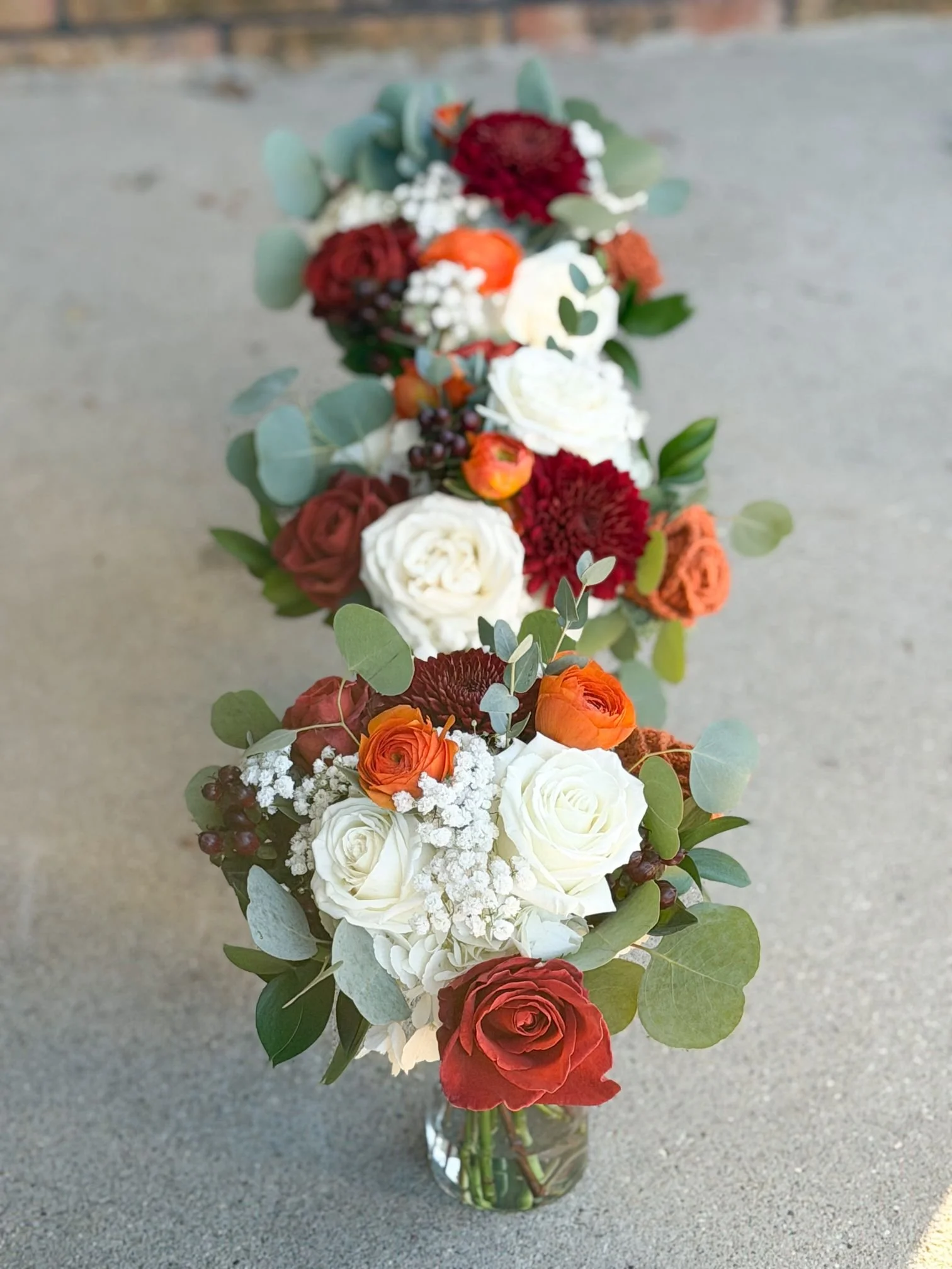 Coffee break orange and white ranunculus euc maids.jpg