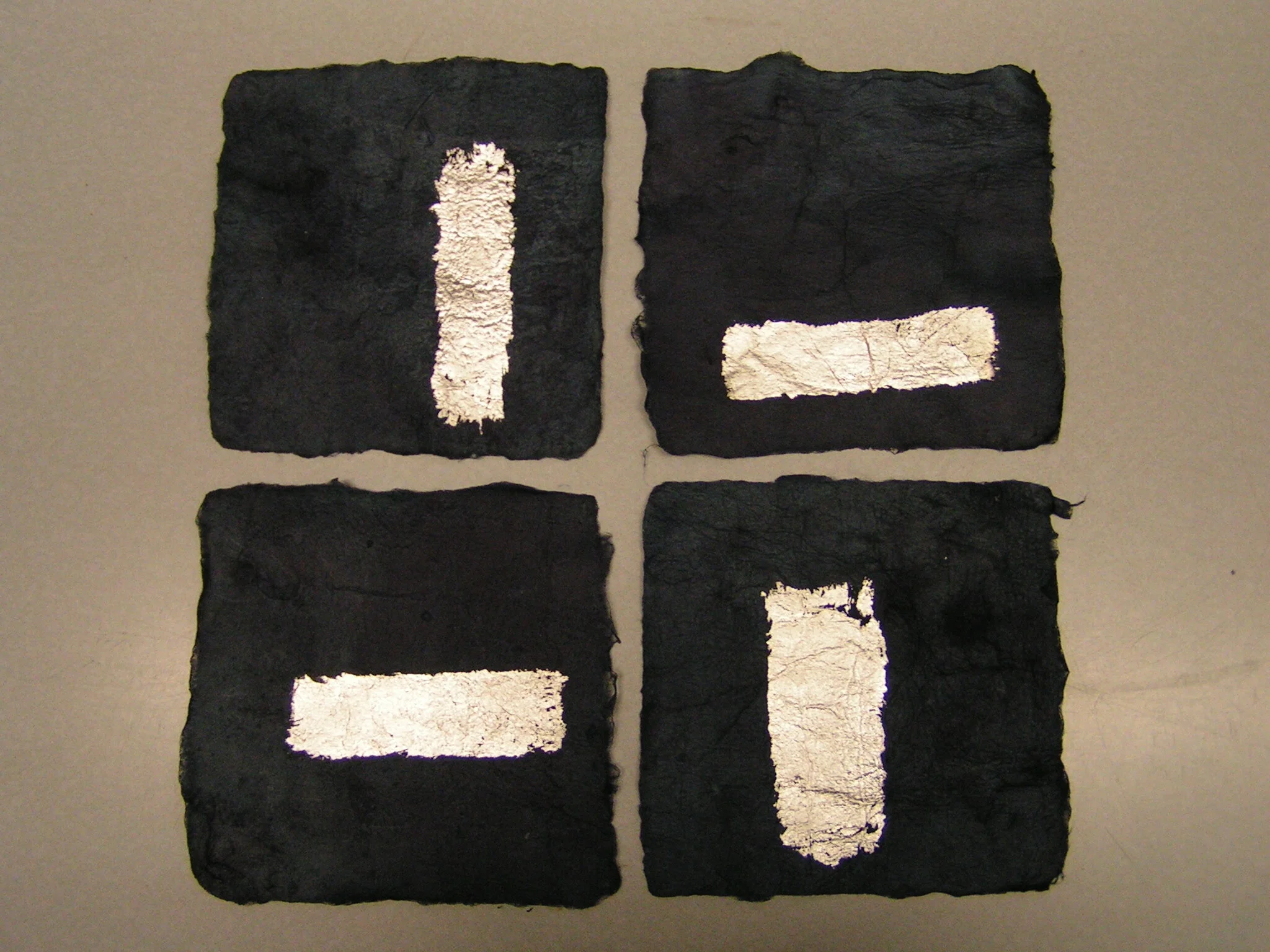 Four Small Stacks, Kozo, indigo and silver leaf, 11" wide x 11" long x 2" high, 2006