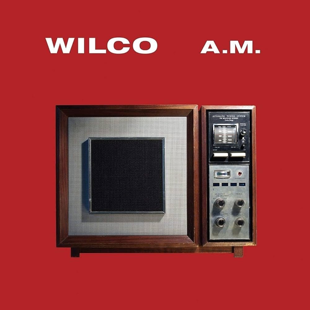From the ashes of the musical group Uncle Tupelo came Wilco&rsquo;s 1995 debut &lsquo;A.M.&rsquo;
An equal parts fusion of country and alternative music, A.M. is a flourishing and gritty record that showcases the roots of Jeff Tweedy&rsquo;s romantic
