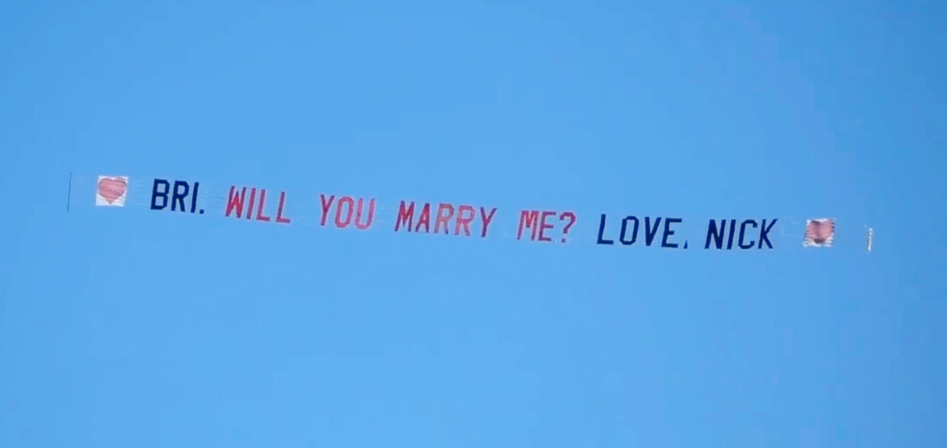 Nick Arcidiacono gets the answer to his aerial proposal to Brianna DeLuca on the beach during the Polar Bear Plunge festivities.