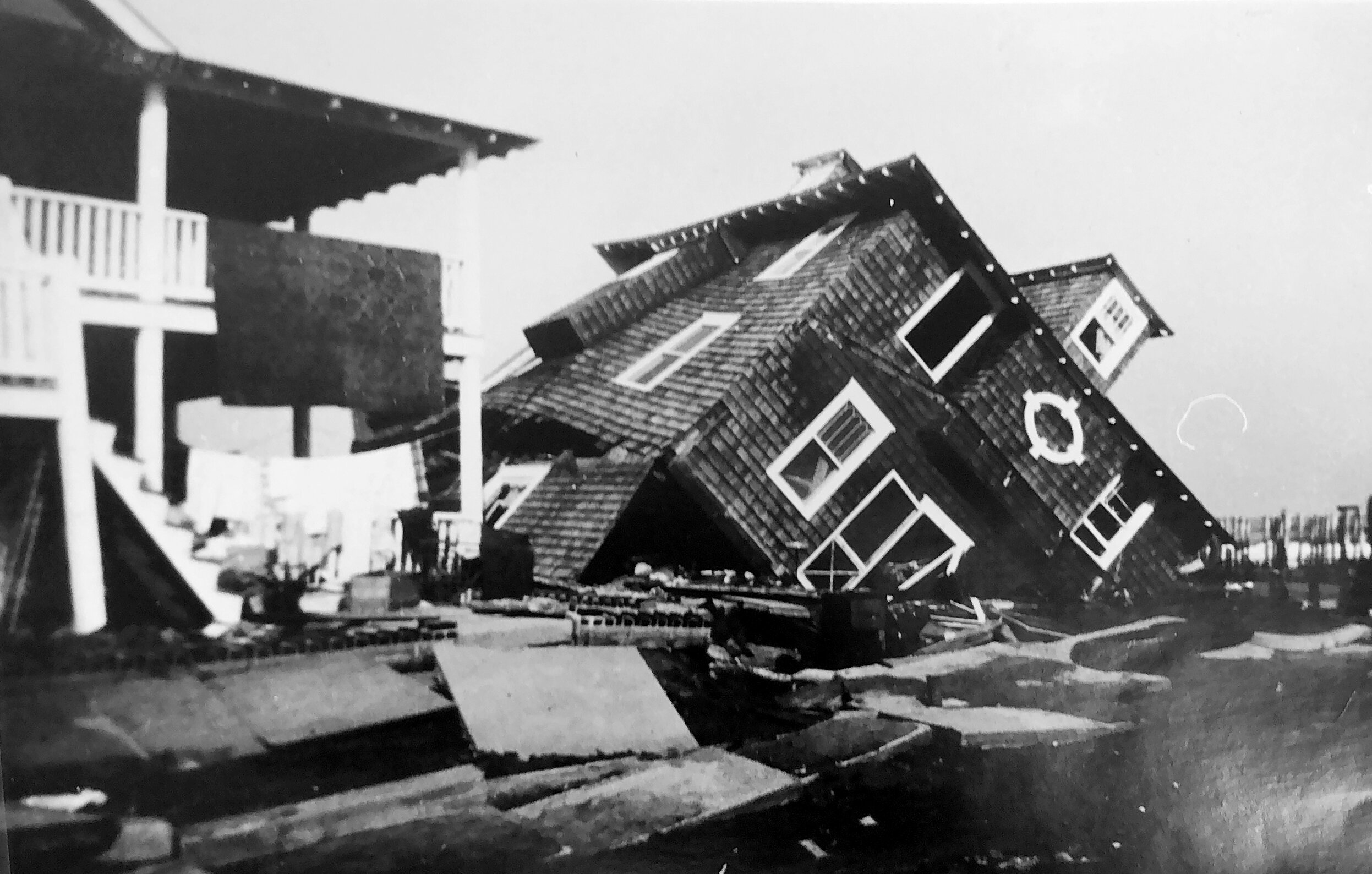 The Holmes residence, also seen above, toppled from its foundation at 33rd Street and the beach.