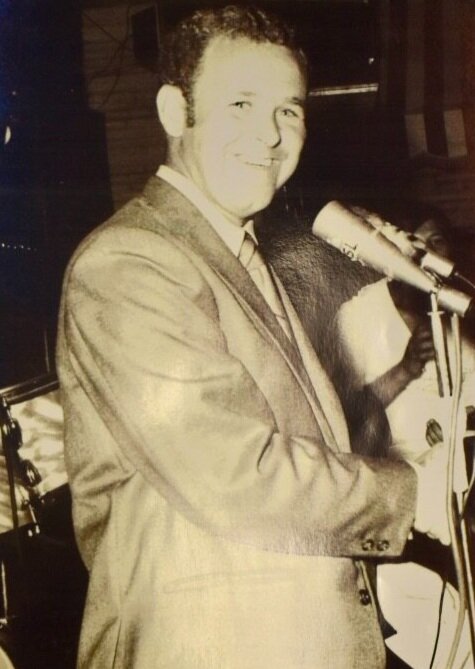 Bill Gallagher is shown addressing the crowd at the 1970 Lifeguard Ball.