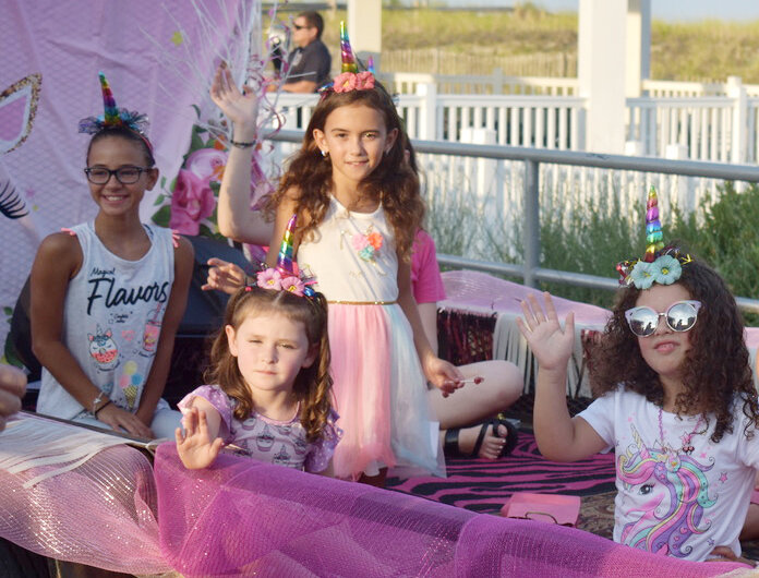 First-place float at the Sea Isle Baby Parade, “Goovy Girlz,” with  children from the  Vandever, Roberts,  DiAntonio, Romano, Frisoli and Powell families.