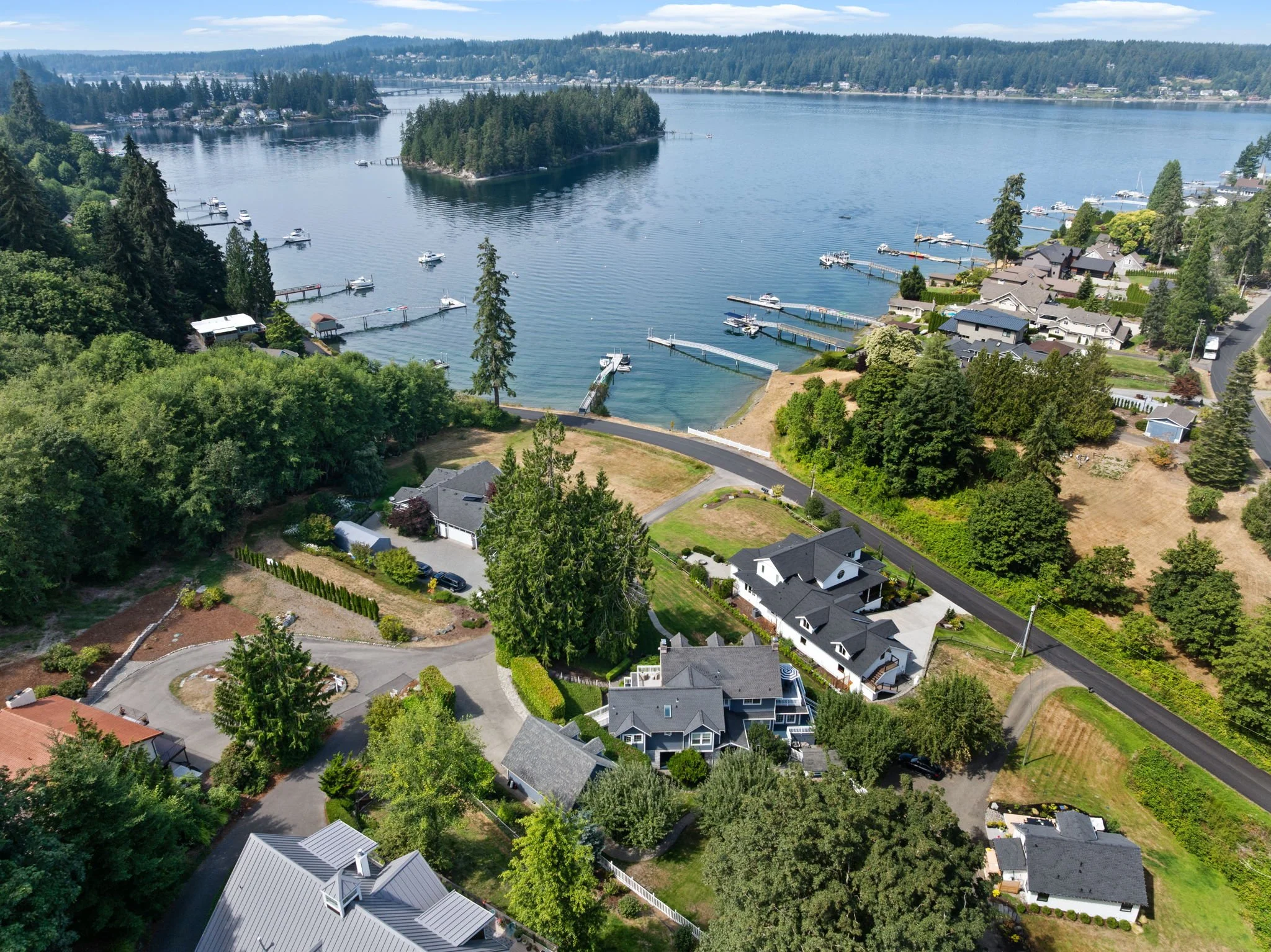 Aerial view of Fox Island waterfront homes and private docks, Gig Harbor WA"