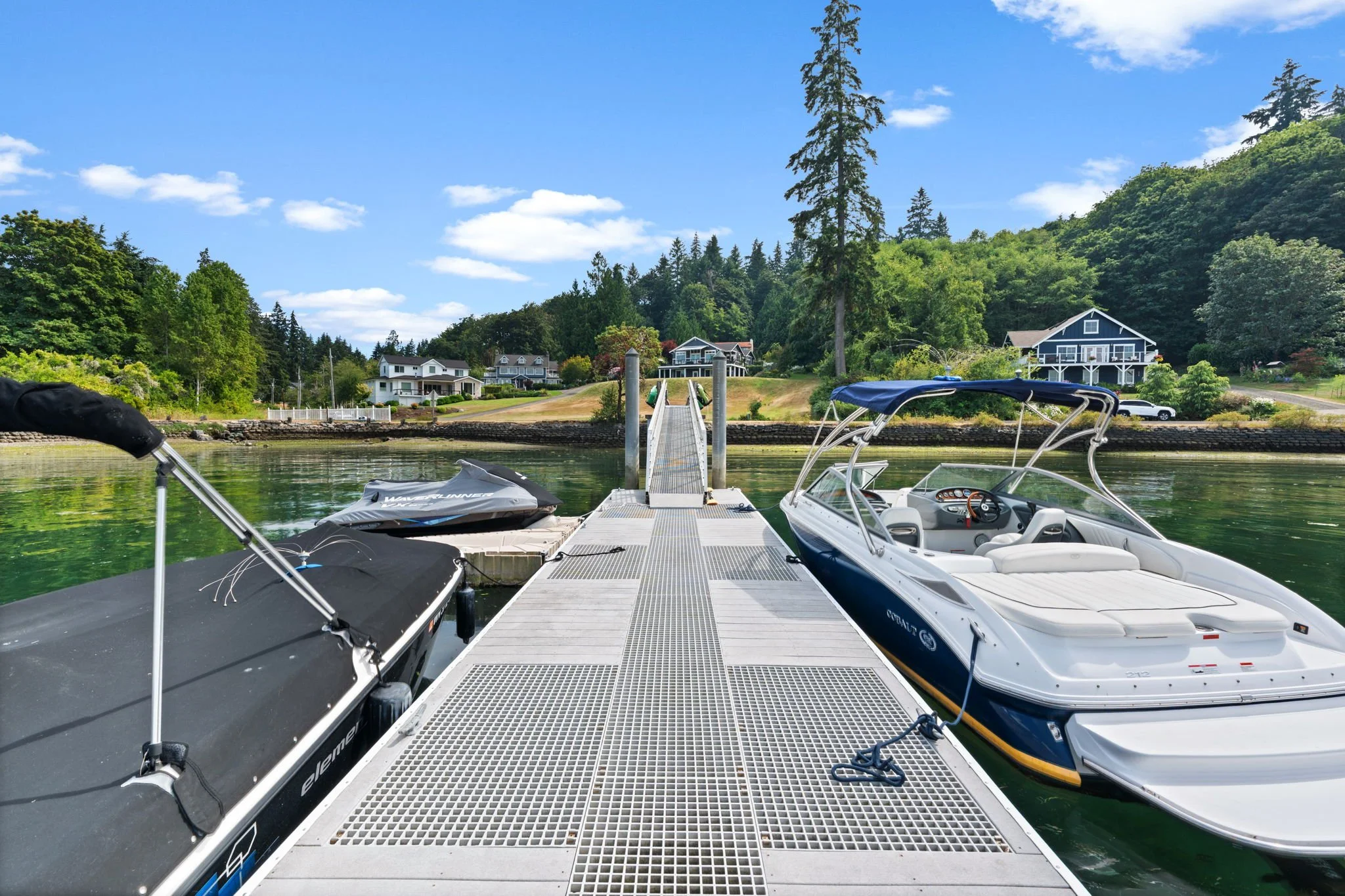 Staircase leading down to medium bank waterfront beach access in Gig Harbor