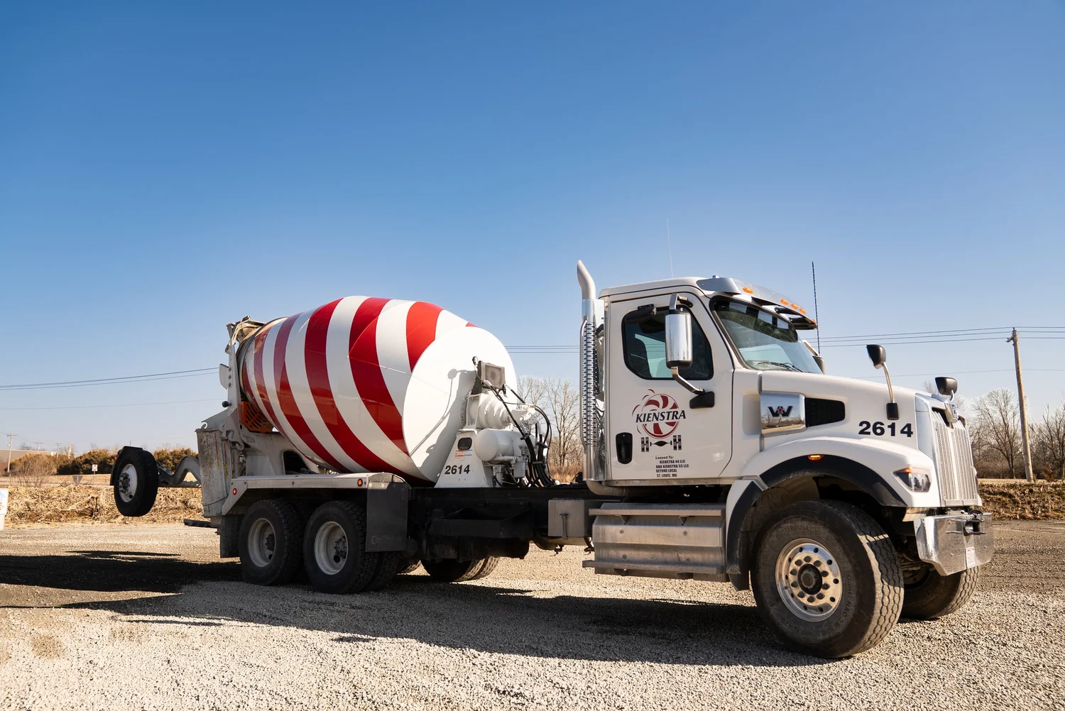 Kienstra ready mix concrete truck with its red and white mixer drum