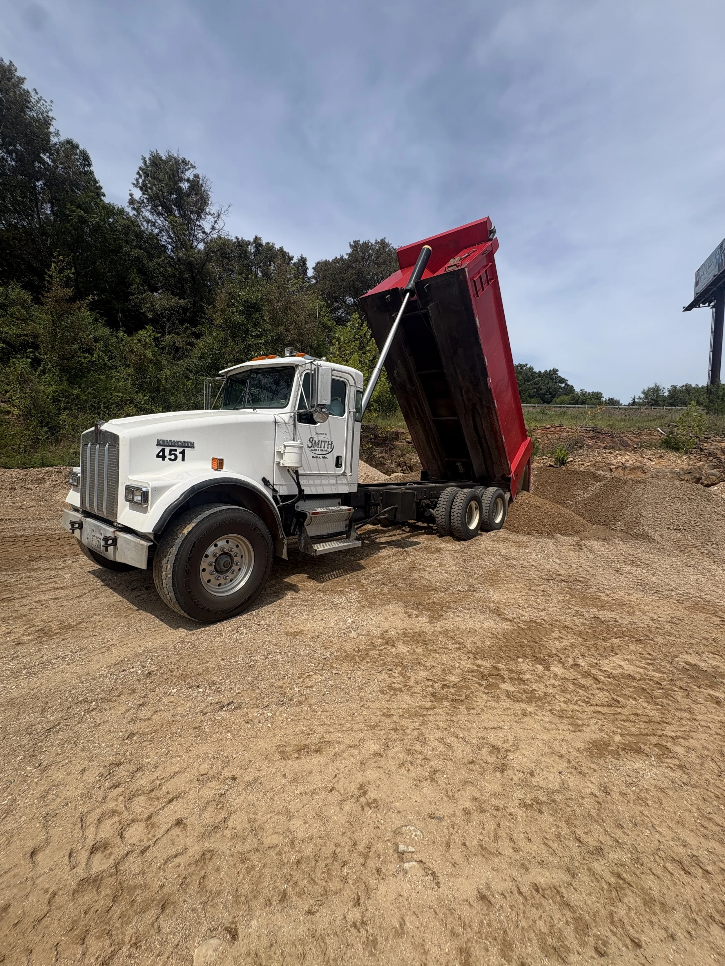 Smith Sand & Gravel dump truck unloading aggregate