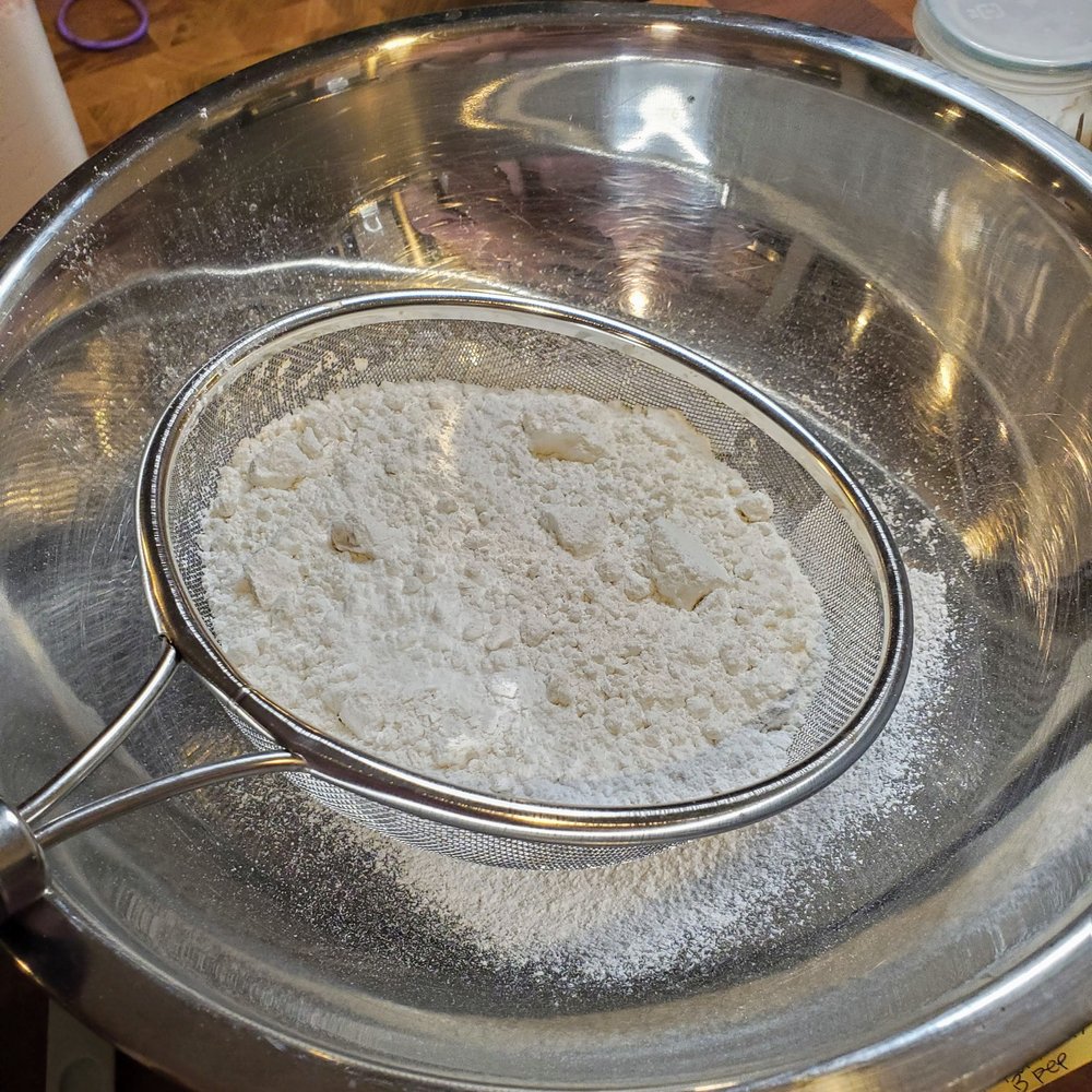 Sift dries into a bowl big enough for all the batter