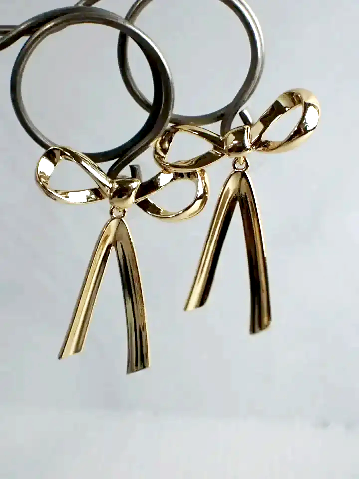 Gold Tone Famarine Bow-Tie Dangle Earrings