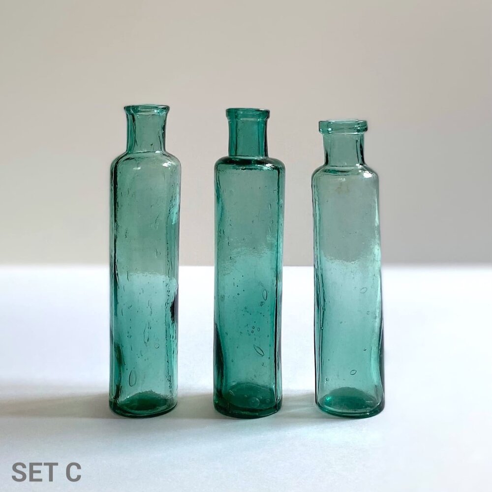 Decorative Glass Bottles And Vases Group Of Small Old Glass Green Bottles  Once Used In Pharmacy To Contain Medicine Stock Photo - Download Image Now  - iStock