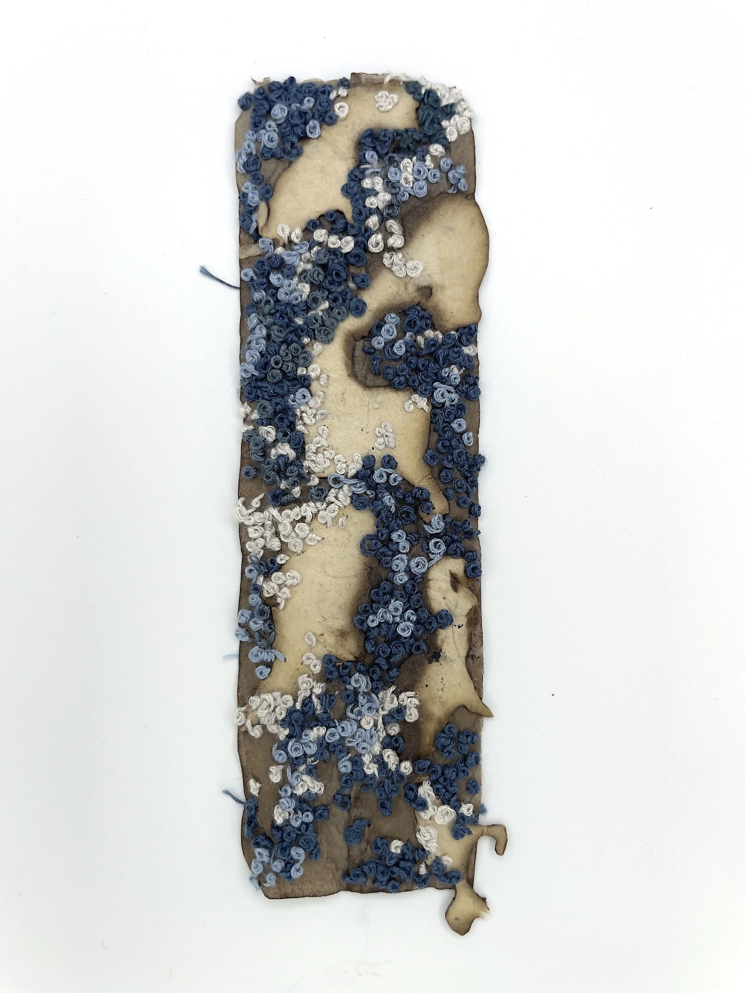 Marking Time 34 , 2023, burned lotka paper, thread, walnut ink dyed teabag, 5.75 x 1.75 inches (unframed), 11.25 x 9.25 inches (framed), $475. (framed)