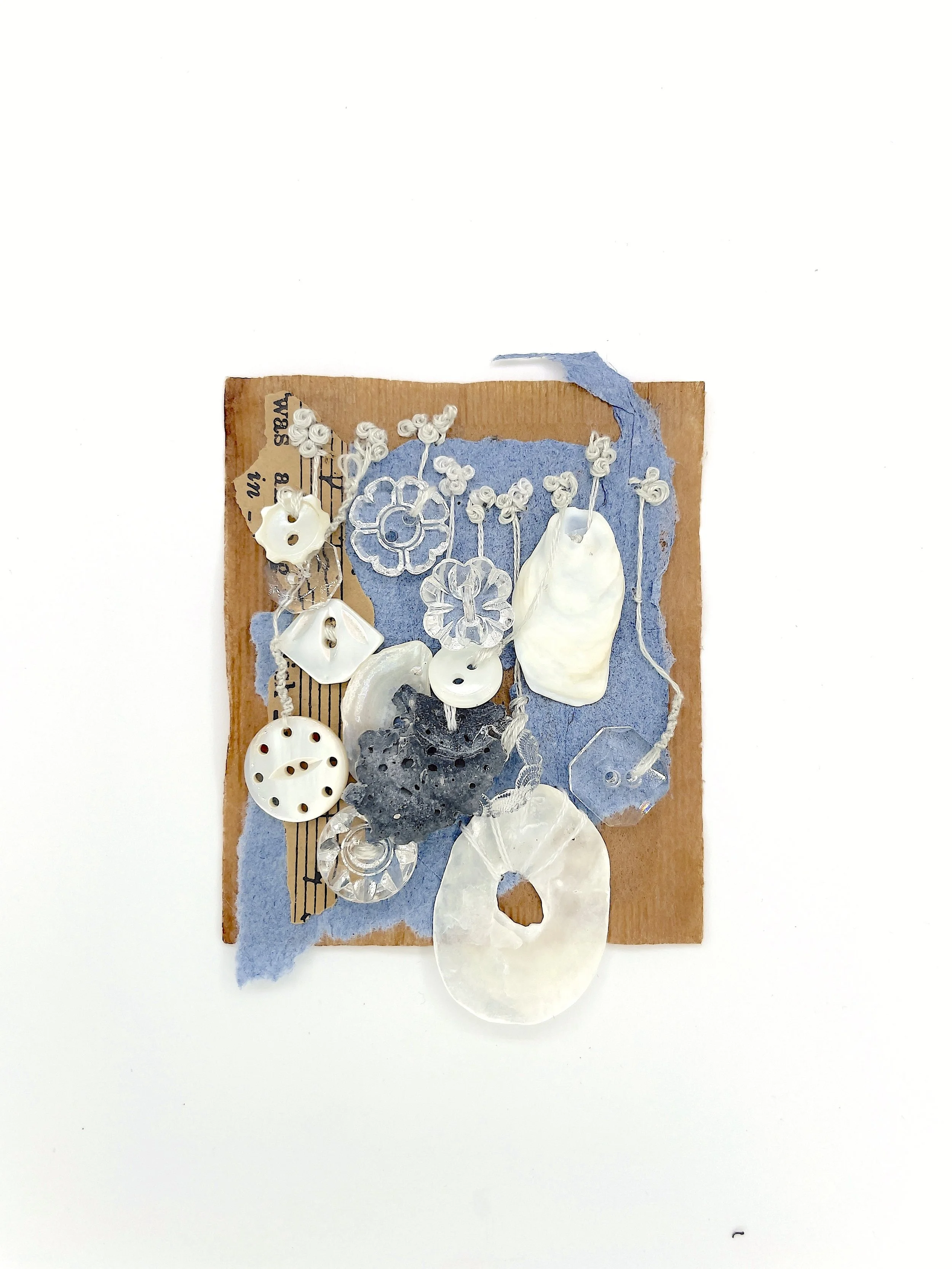 Marking Time 83 , 2023, buttons, shells, handmade paper, sheet paper, thread, teabag, 3 x 2.75 inches (unframed), 11.25 x 9.25 inches (framed), $475. (framed)