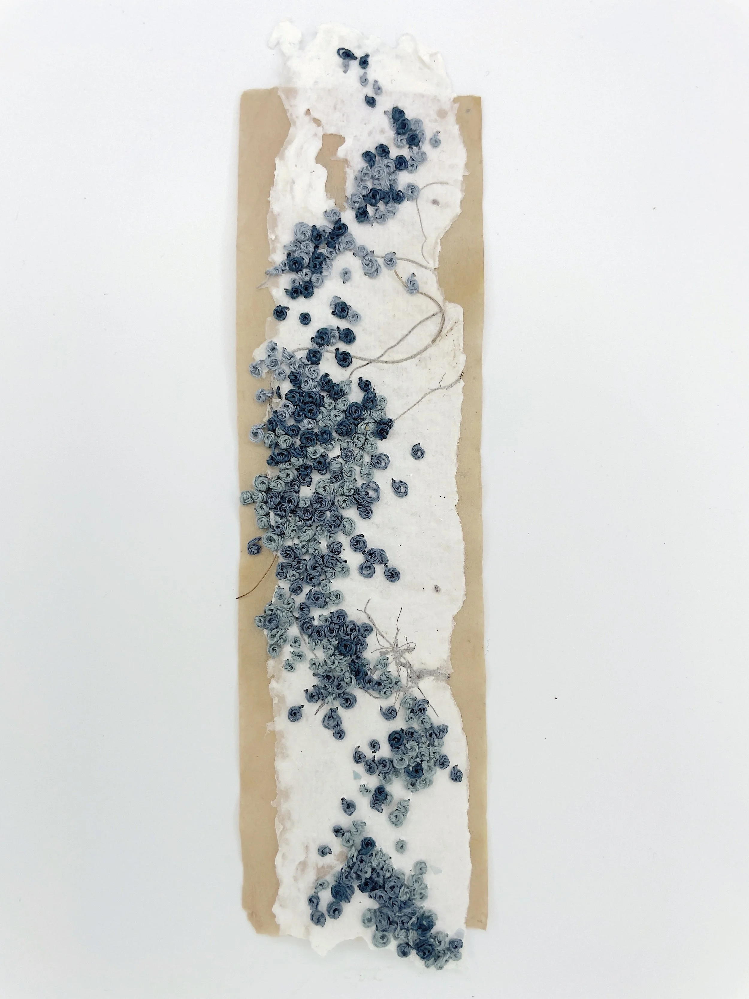 Marking Time 92 , handmade paper embedded with eggshells and deconstructed bird nest, thread, teabag, 5.75 x 1.75 inches (unframed), 11.25 x 9.25 inches (framed), $475. (framed)